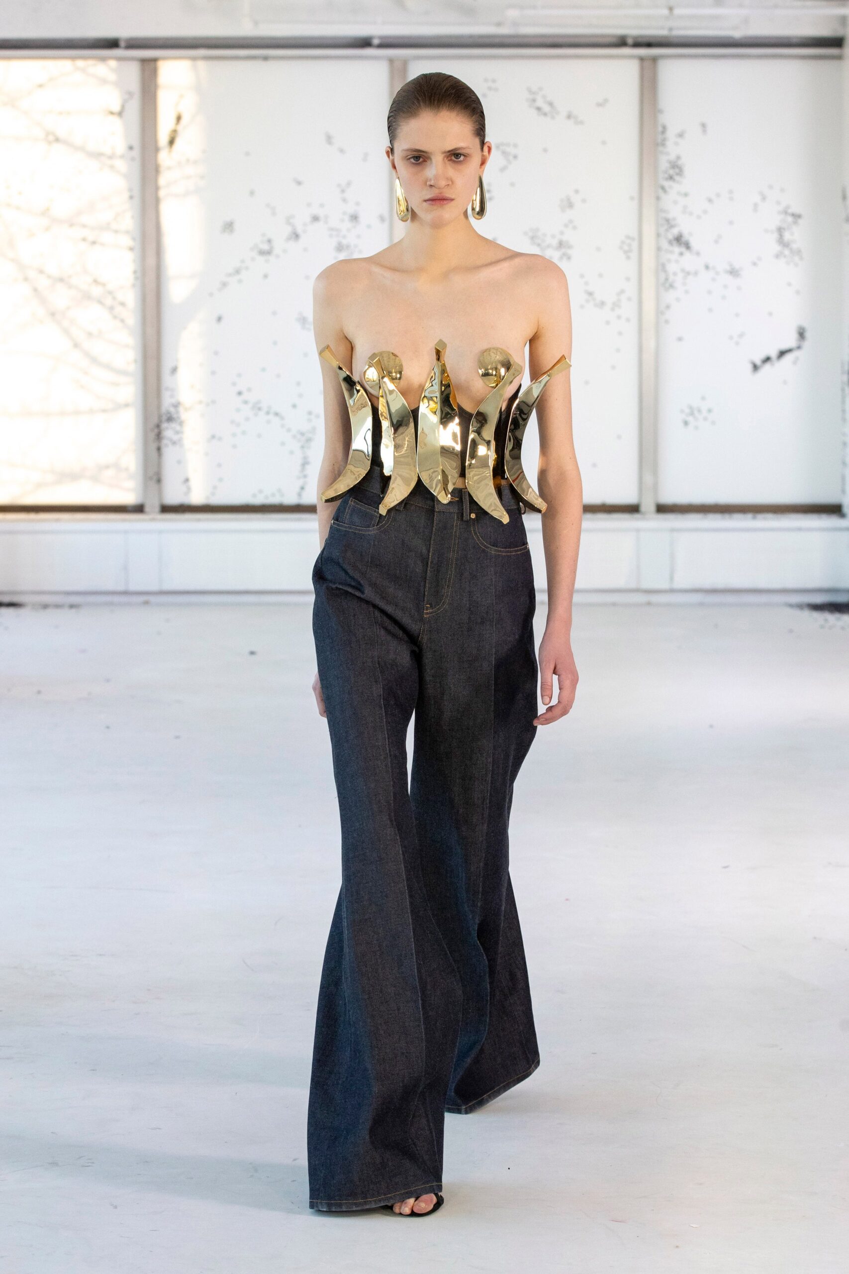 gold metallic corset with denim pants