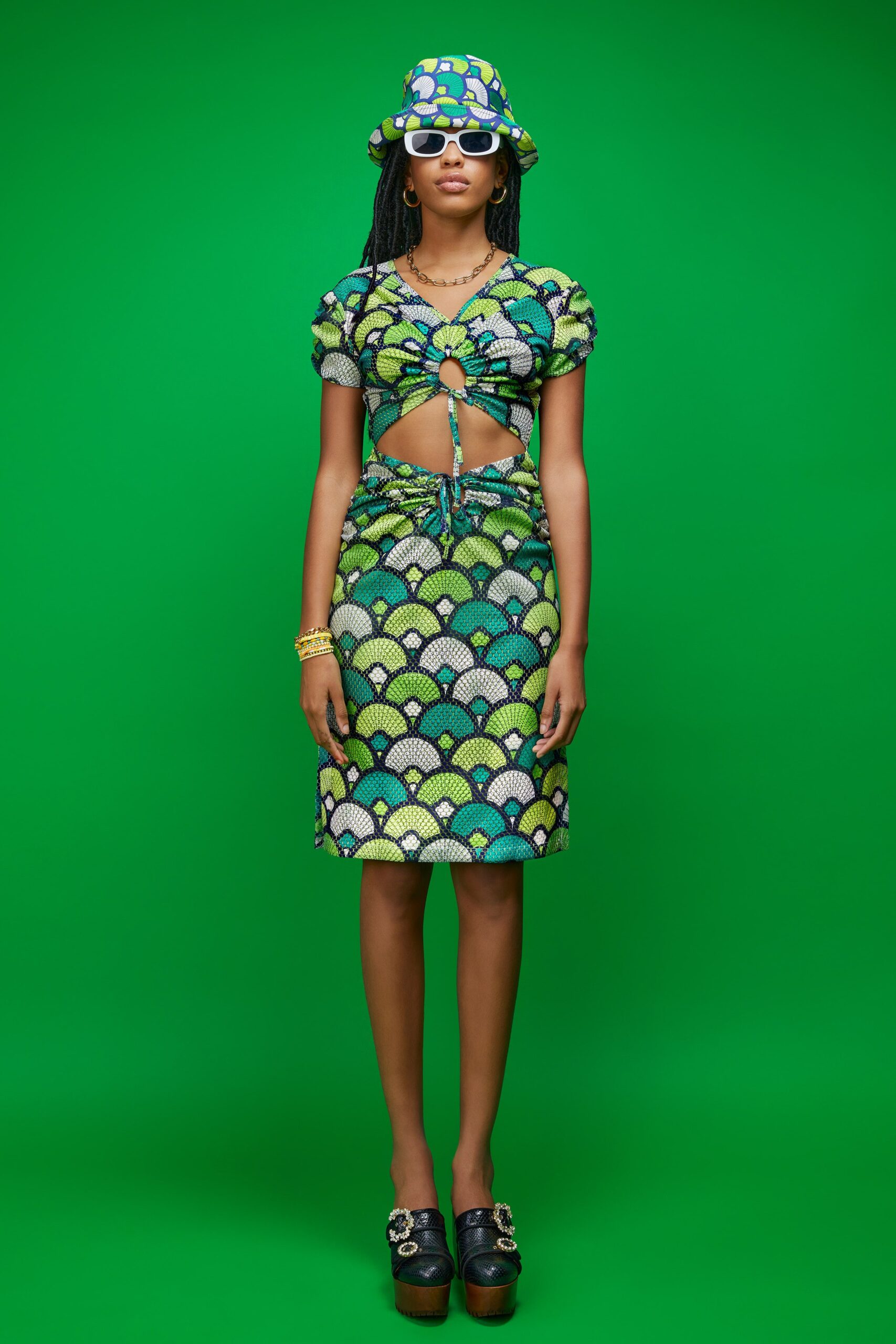 green sleeveless cutout fitted printed ruched mini dress