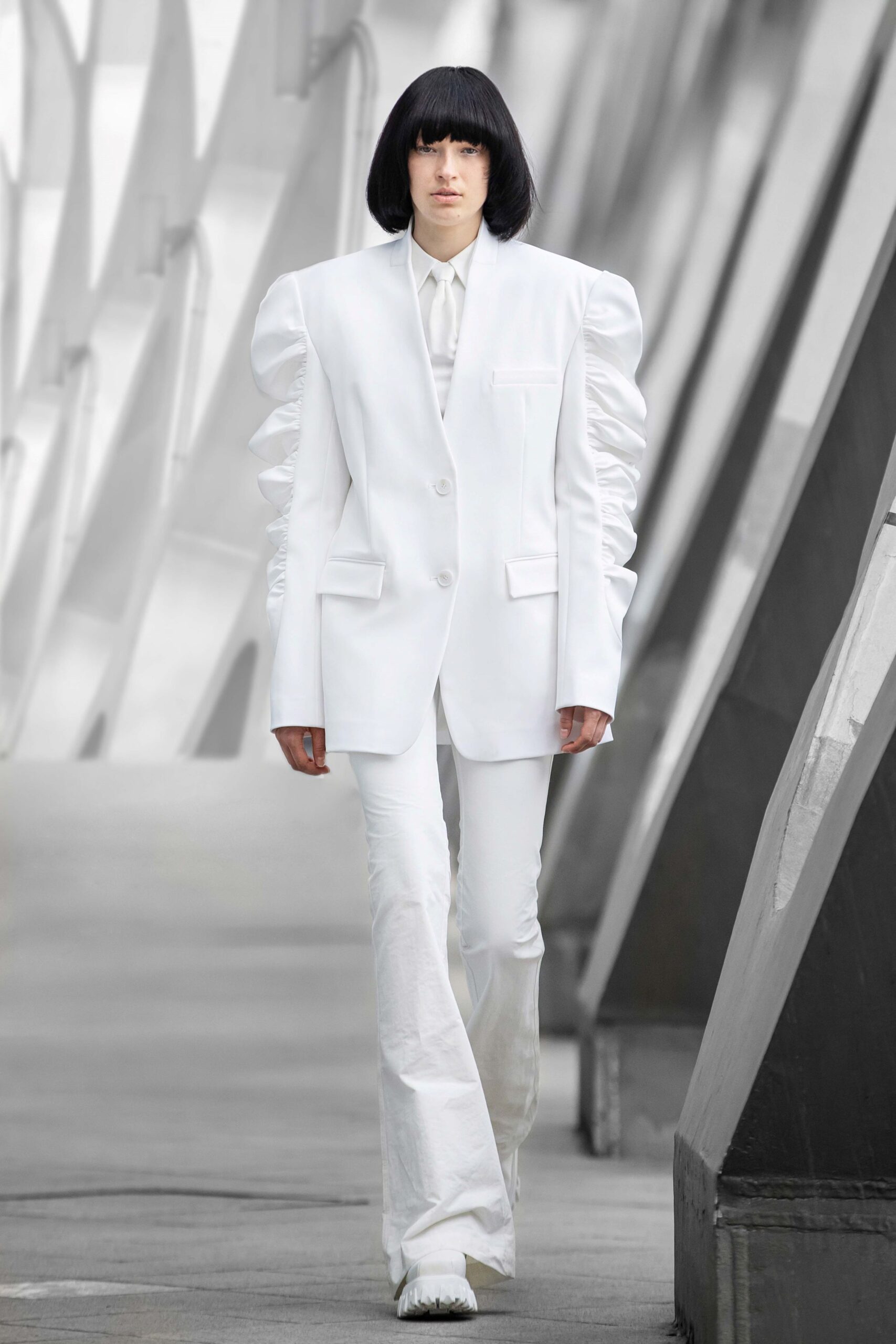 white tailored blazer and flared pants