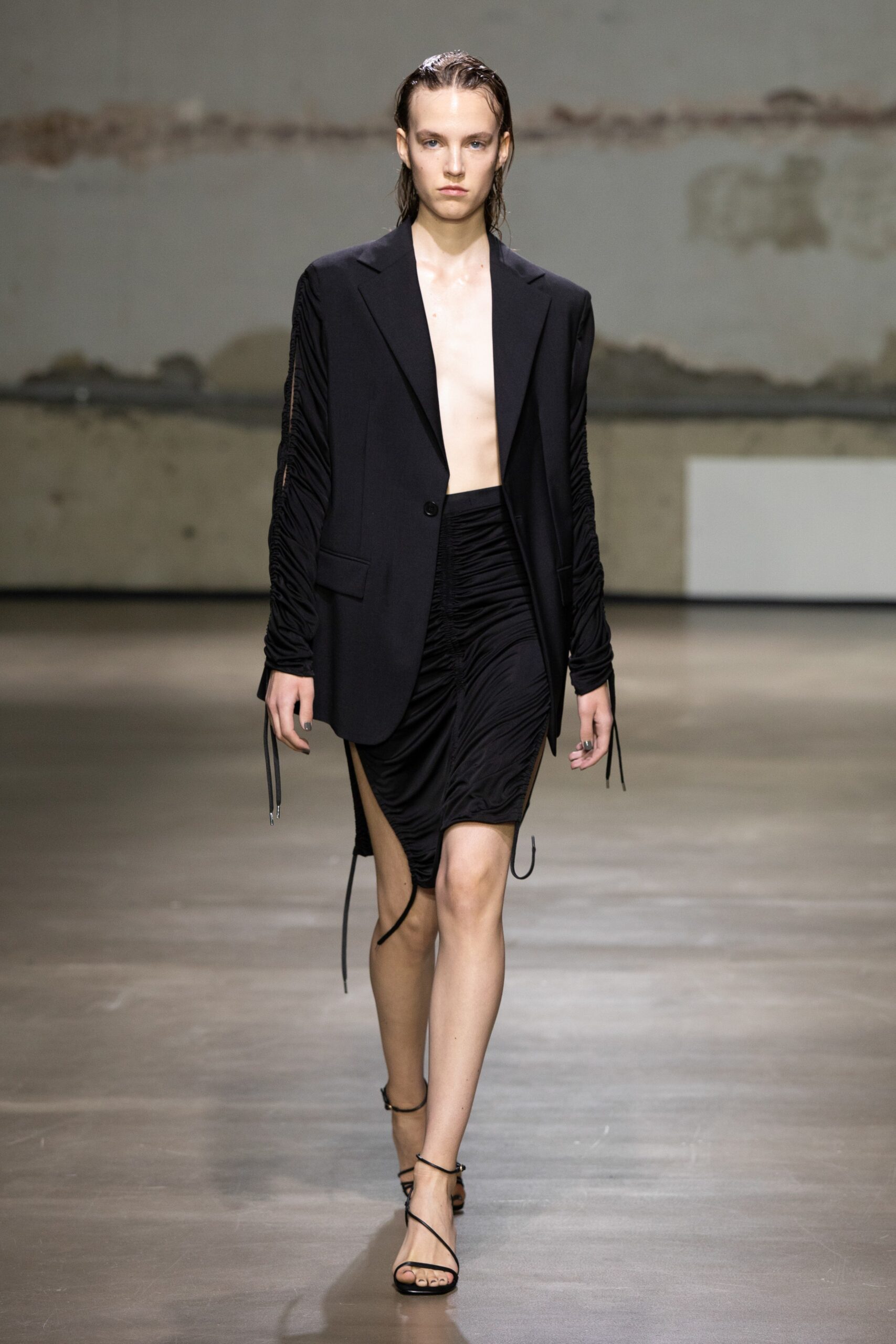 black structured blazer and fitted skirt