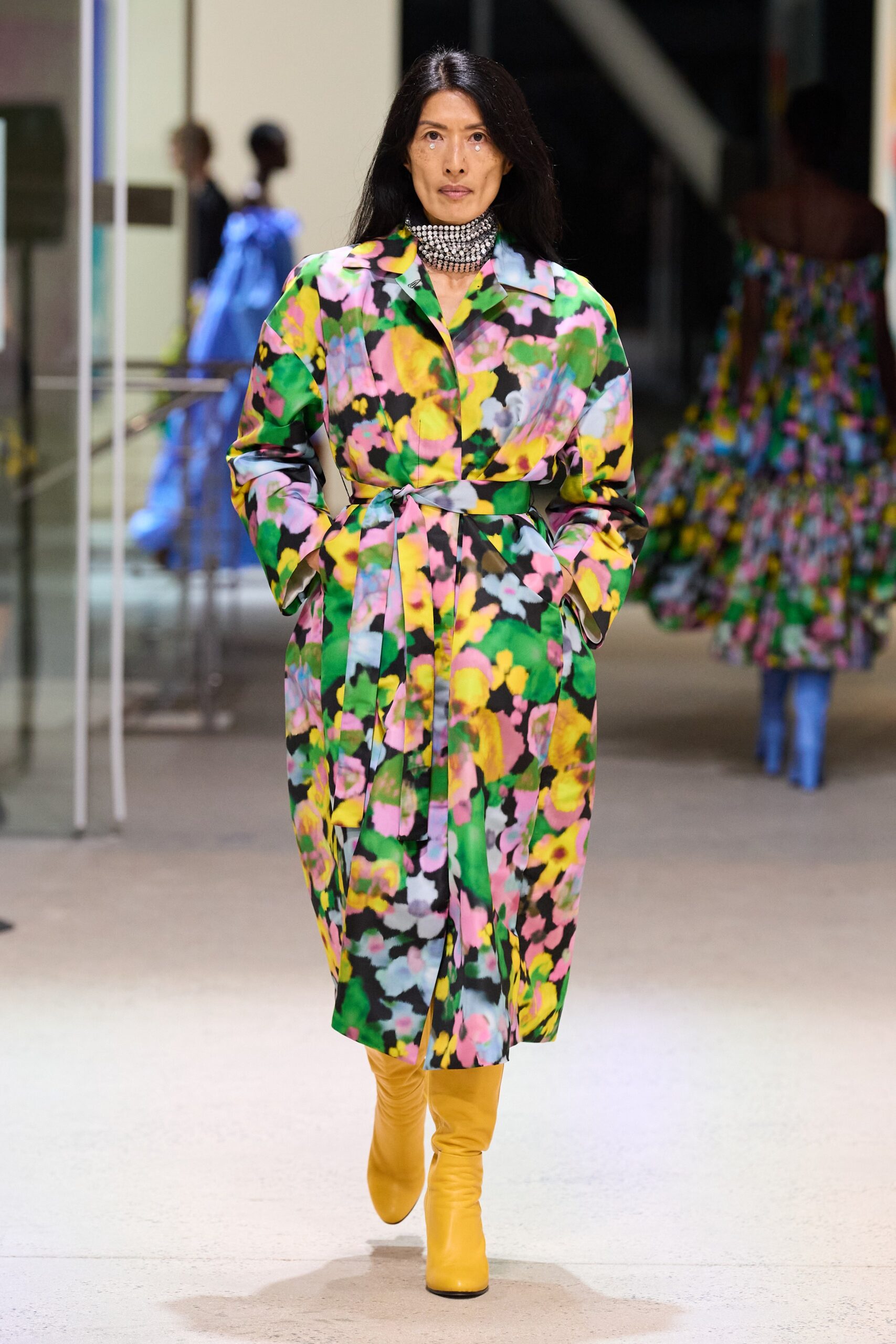 multi-colored belted coat with yellow boots