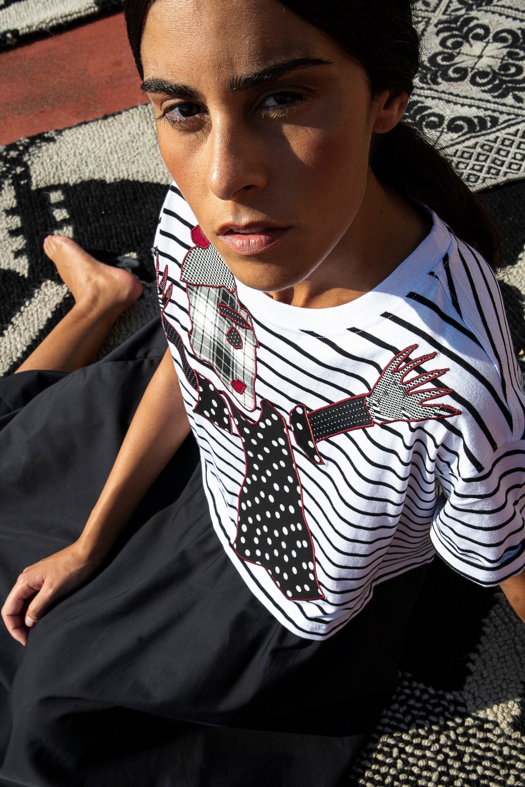 striped top with black skirt