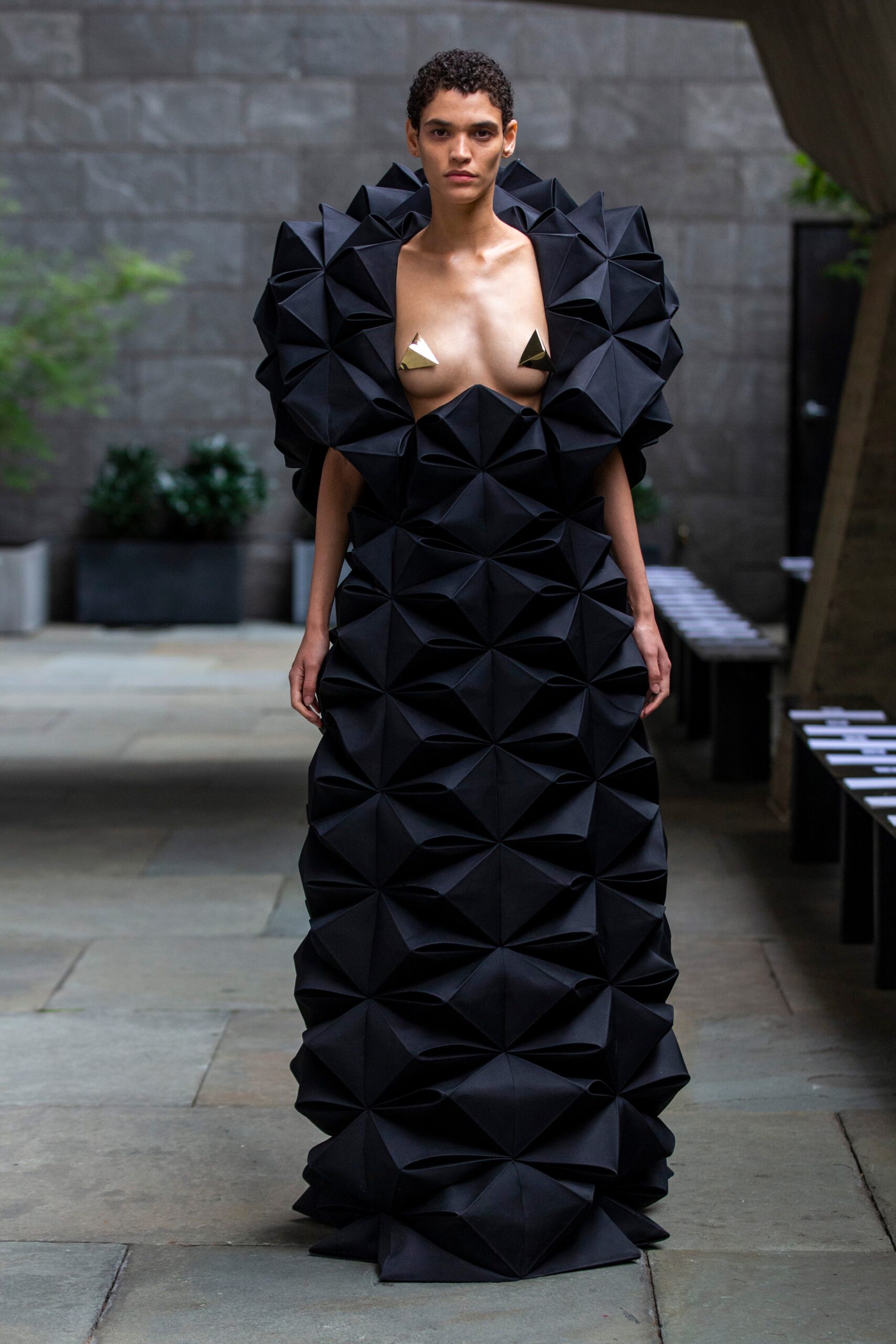 black pleated sleeveless gown