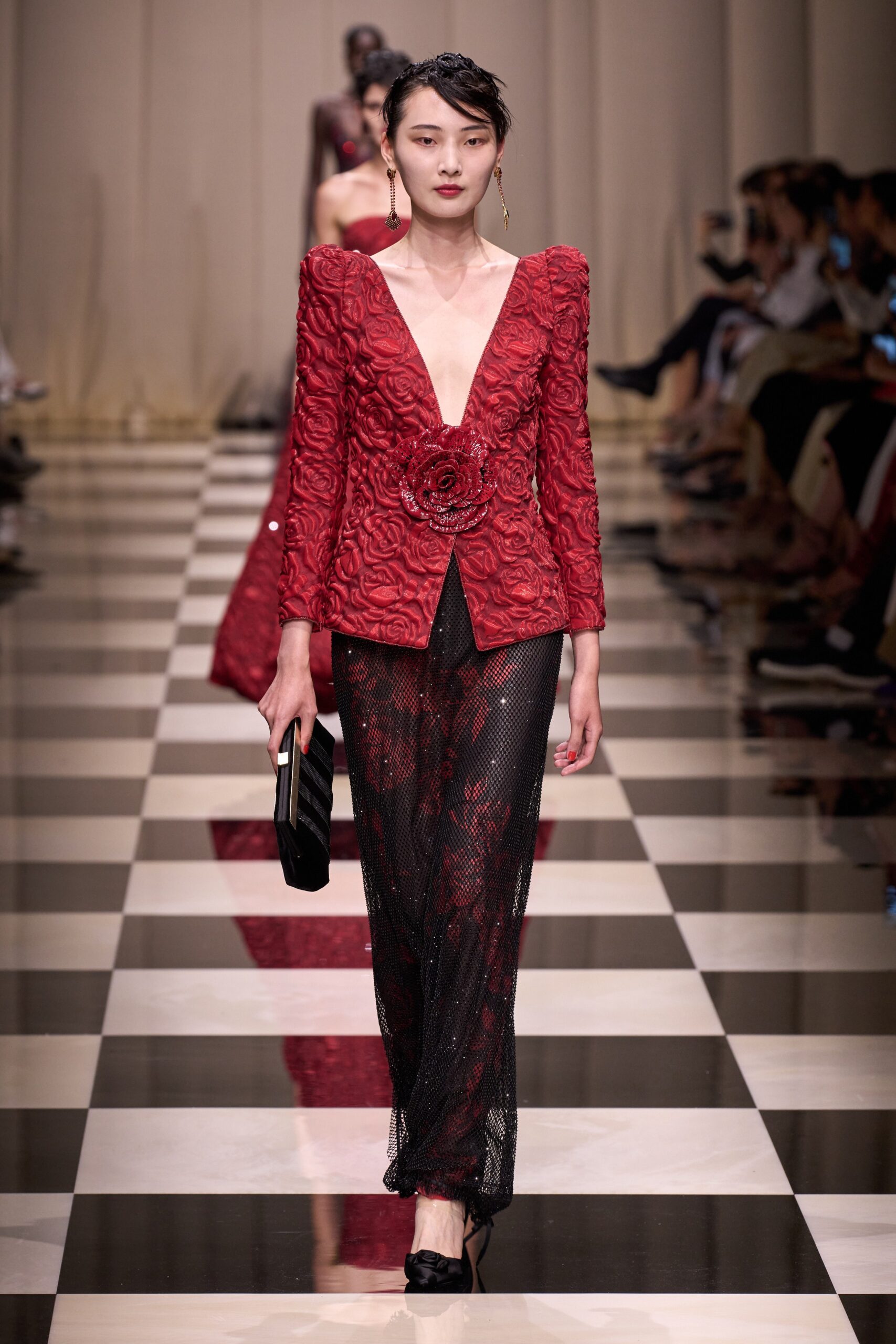 red embroidered blazer with black skirt