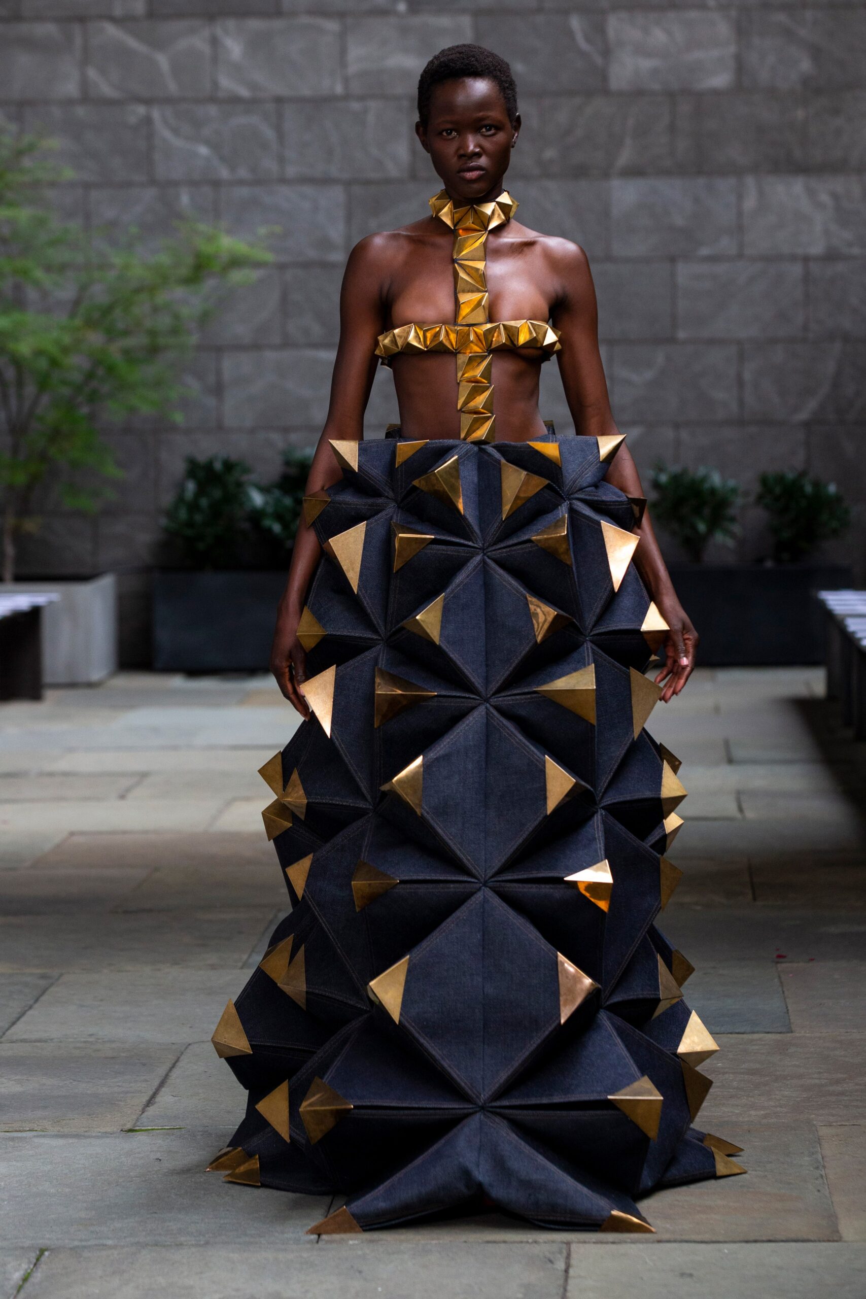black denim gown with gold accents
