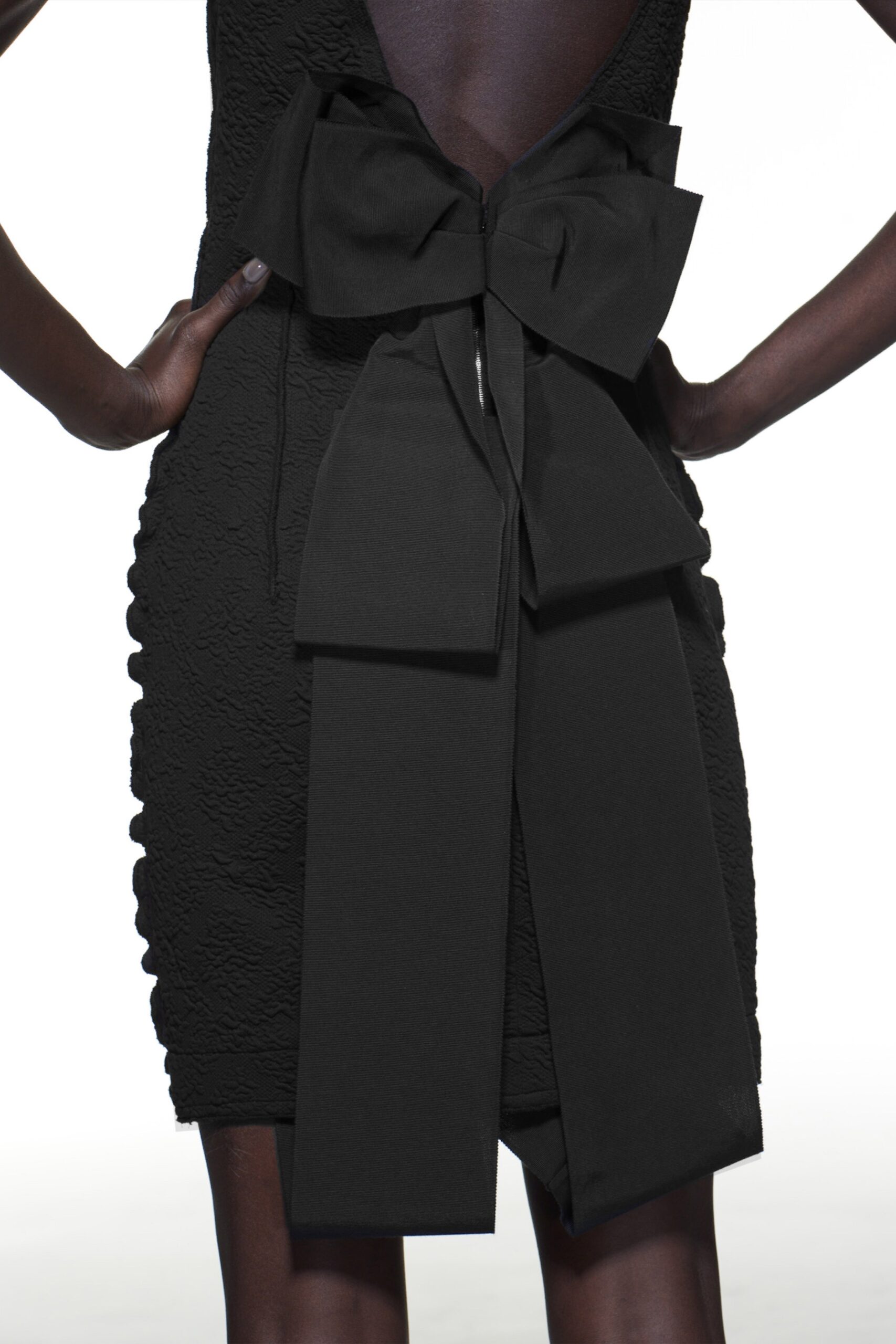 fitted black sleeveless dress