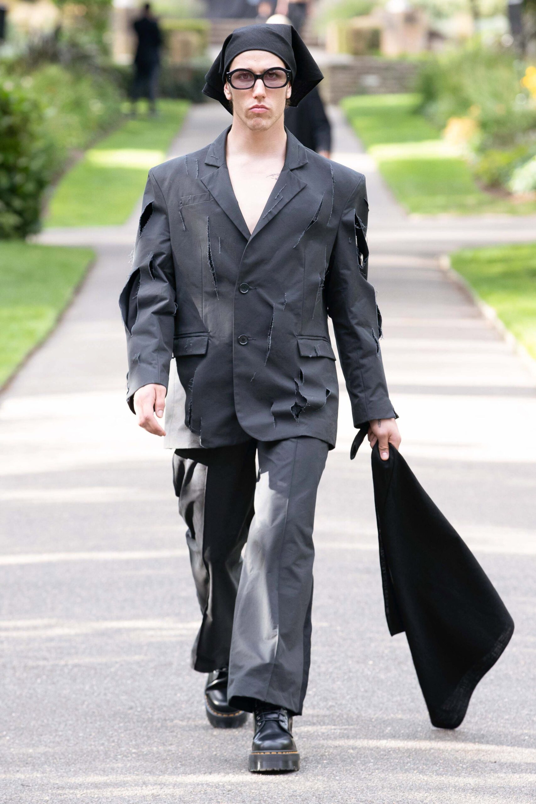 black distressed suit with bag