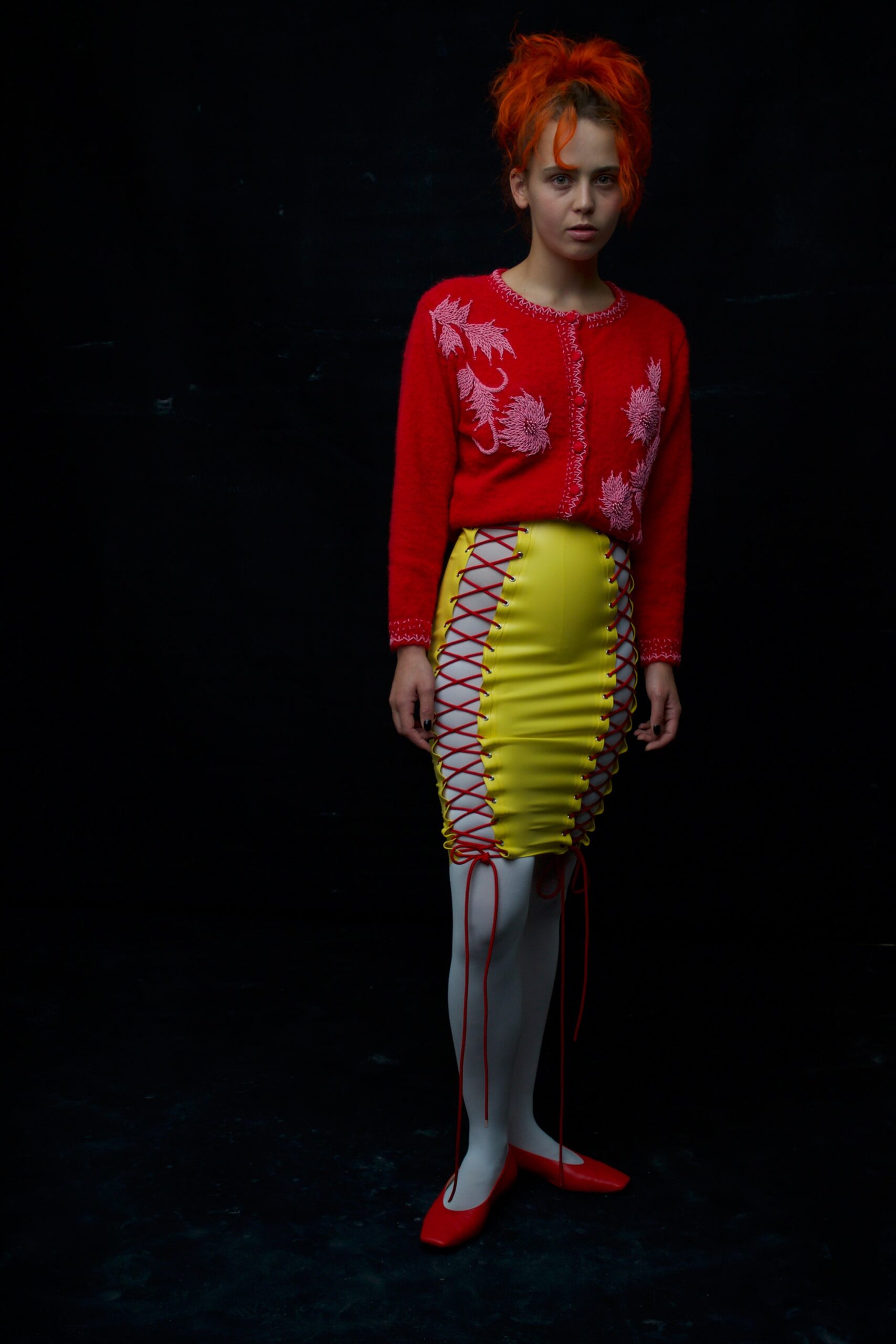 red embroidered cardigan and yellow ruched skirt