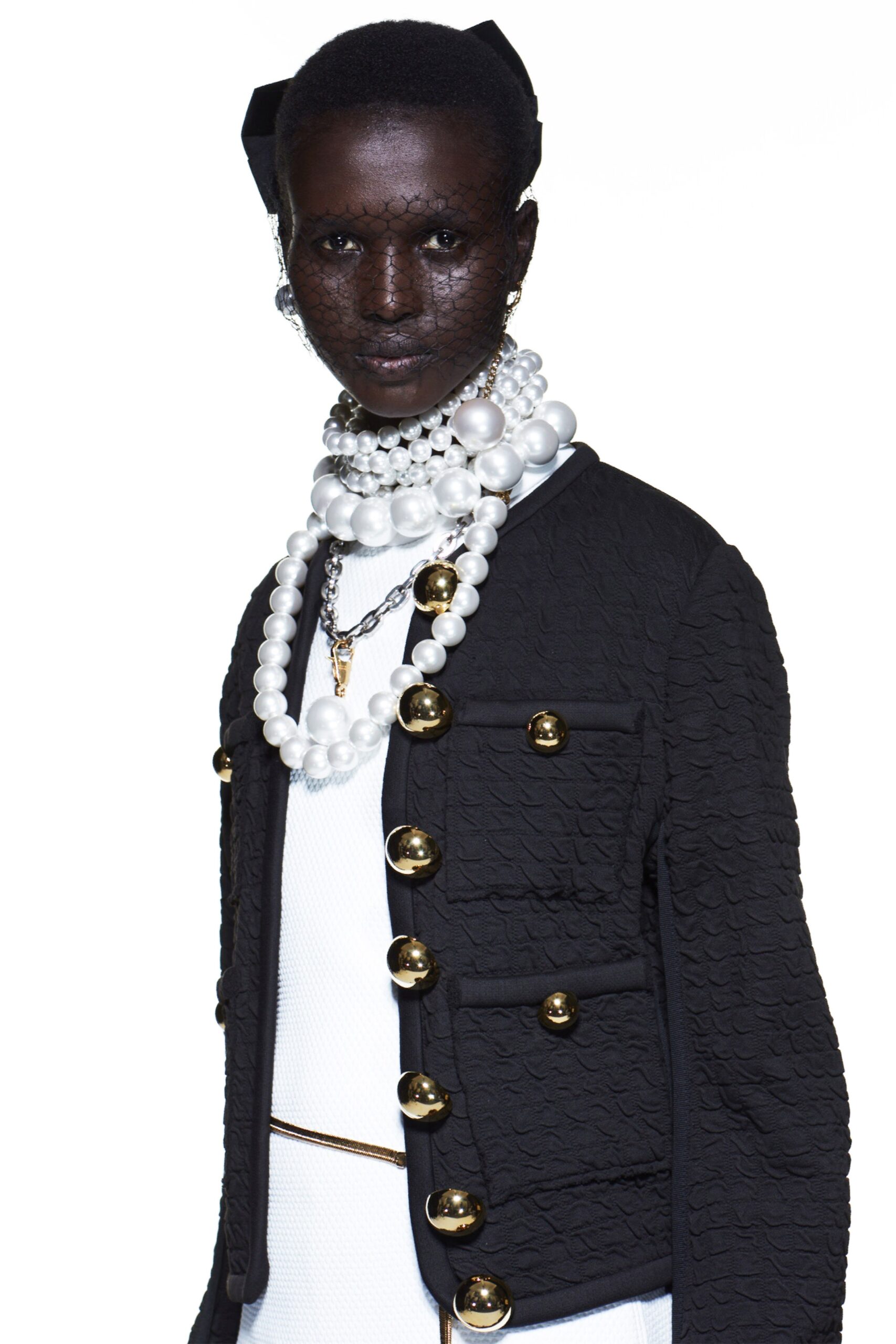 black fitted jacket with white dress