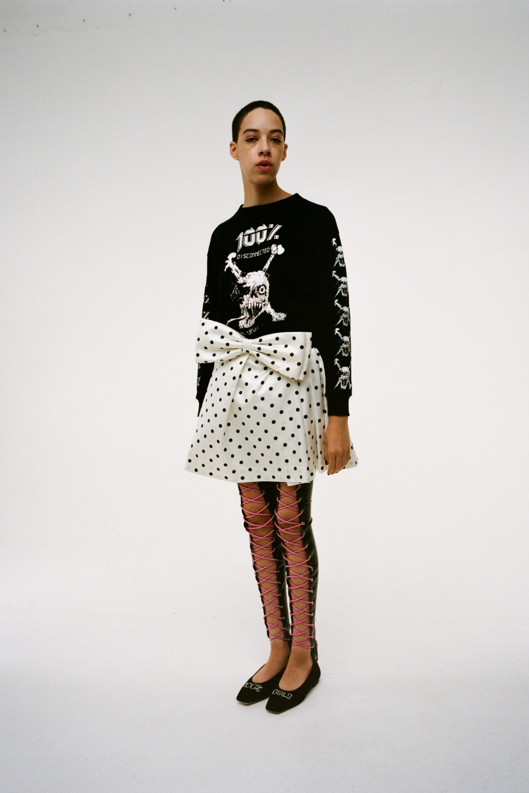 black top white polka-dot skirt