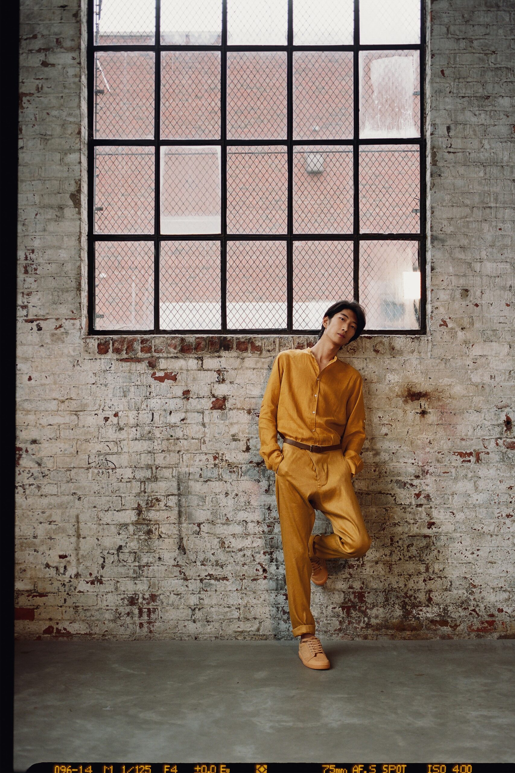 yellow relaxed jumpsuit with beige shoes