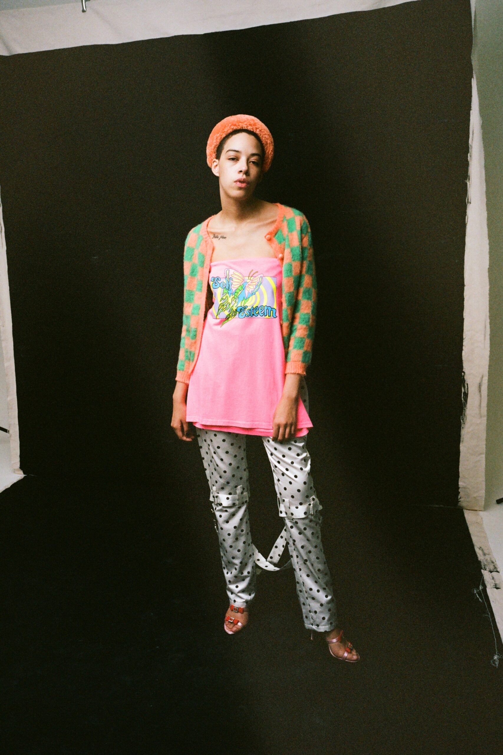 pink top with green cardigan