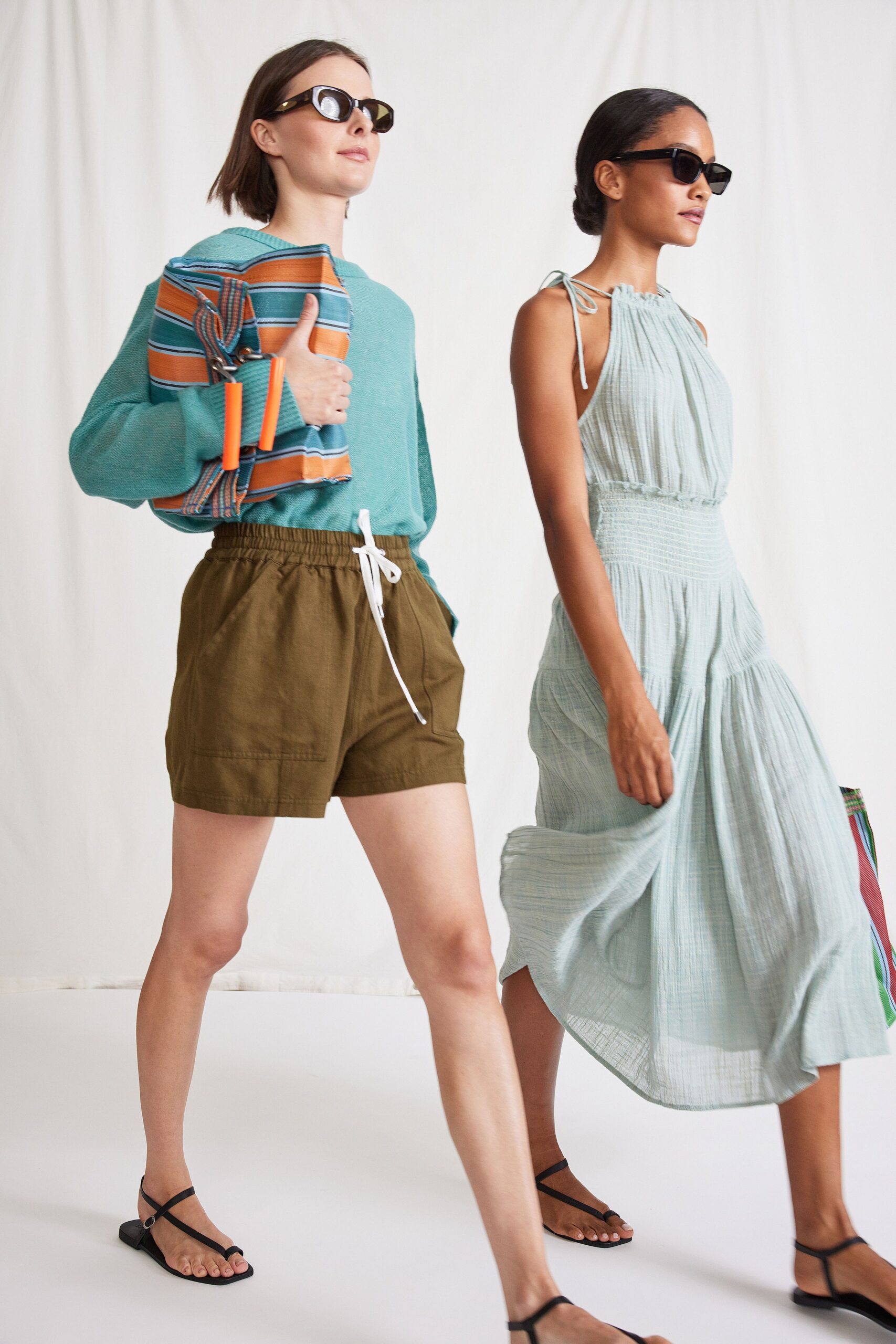 blue striped top with brown shorts and light blue dress