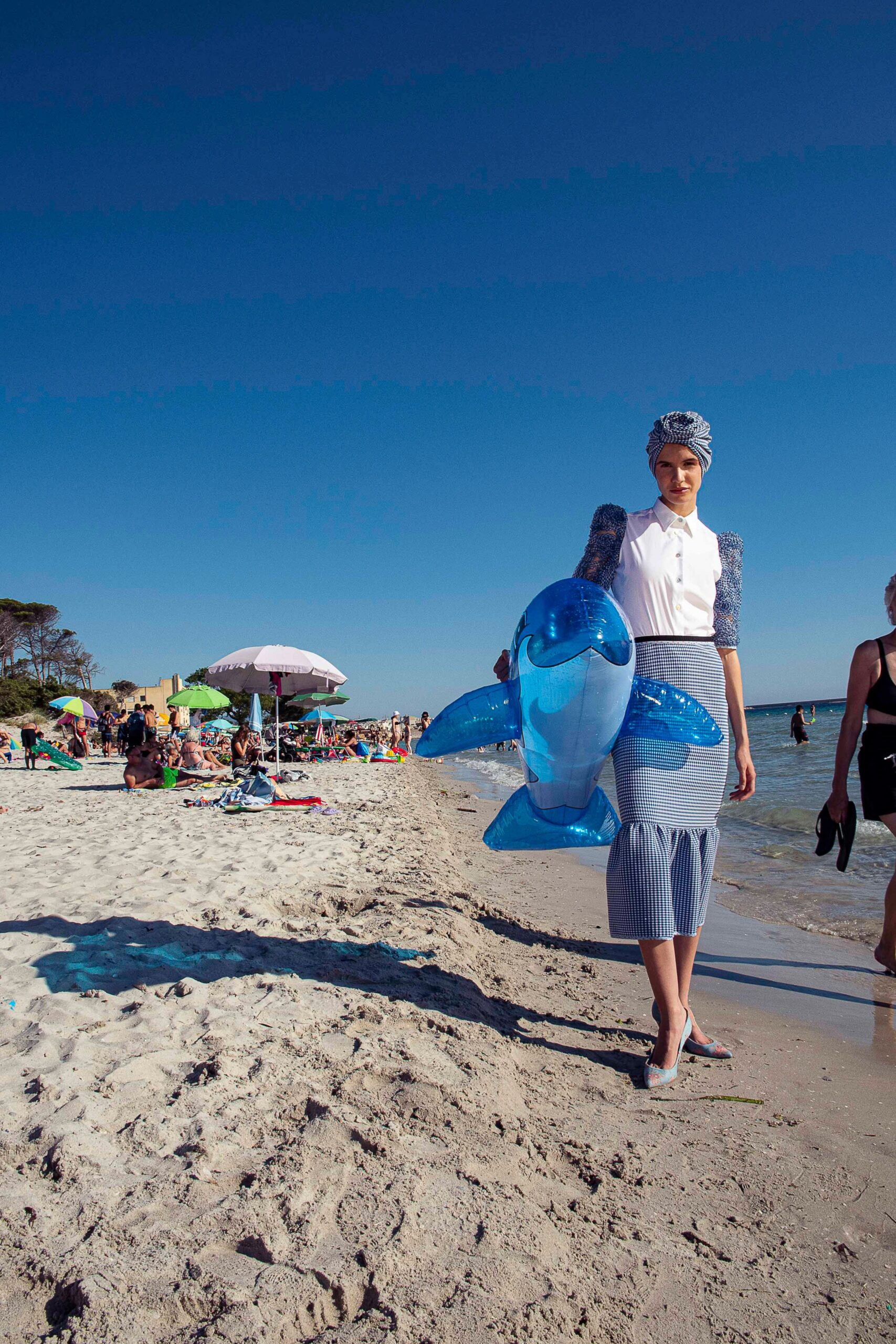 white shirt-dress with blue pleated skirt