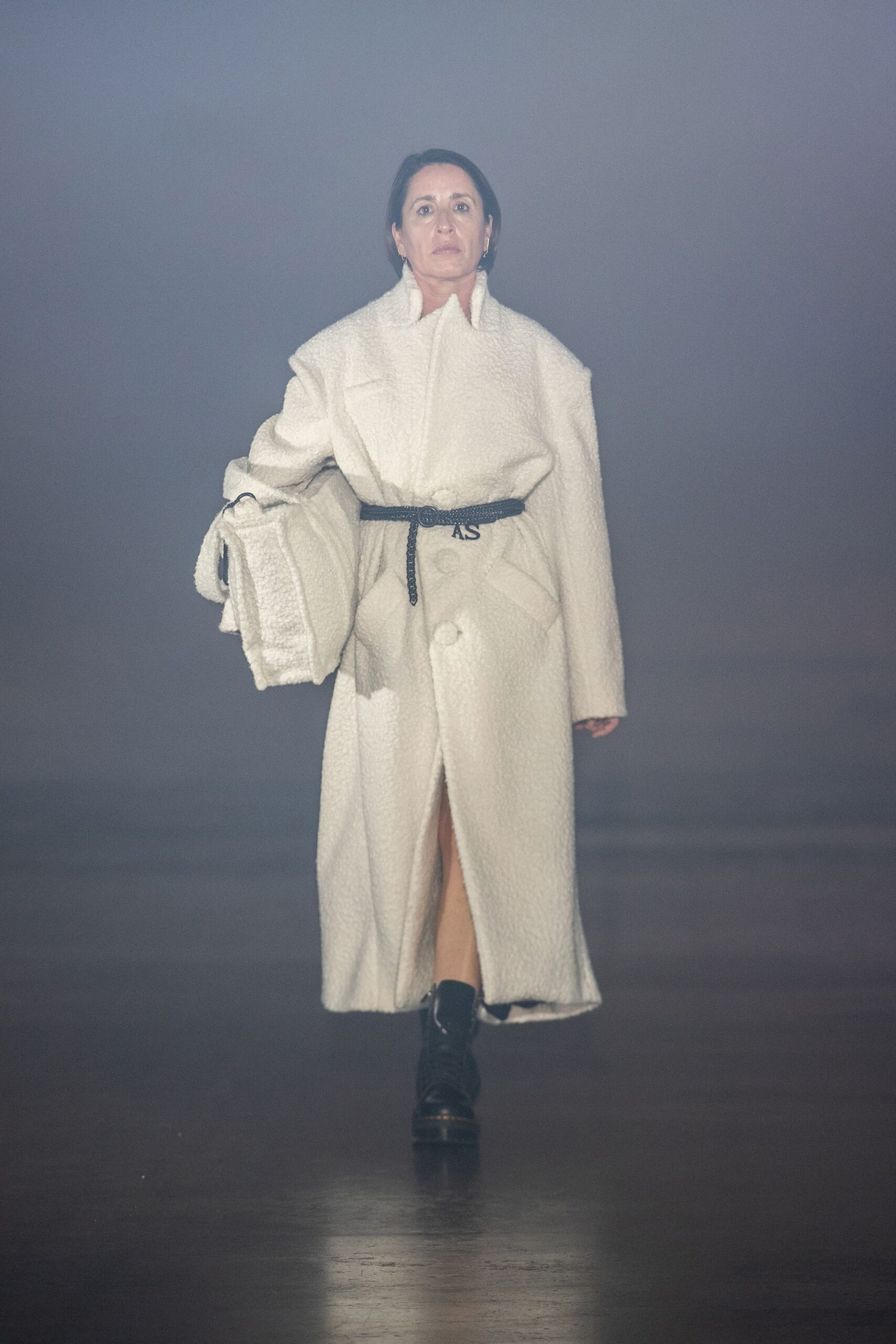 white wool relaxed coat with black pants