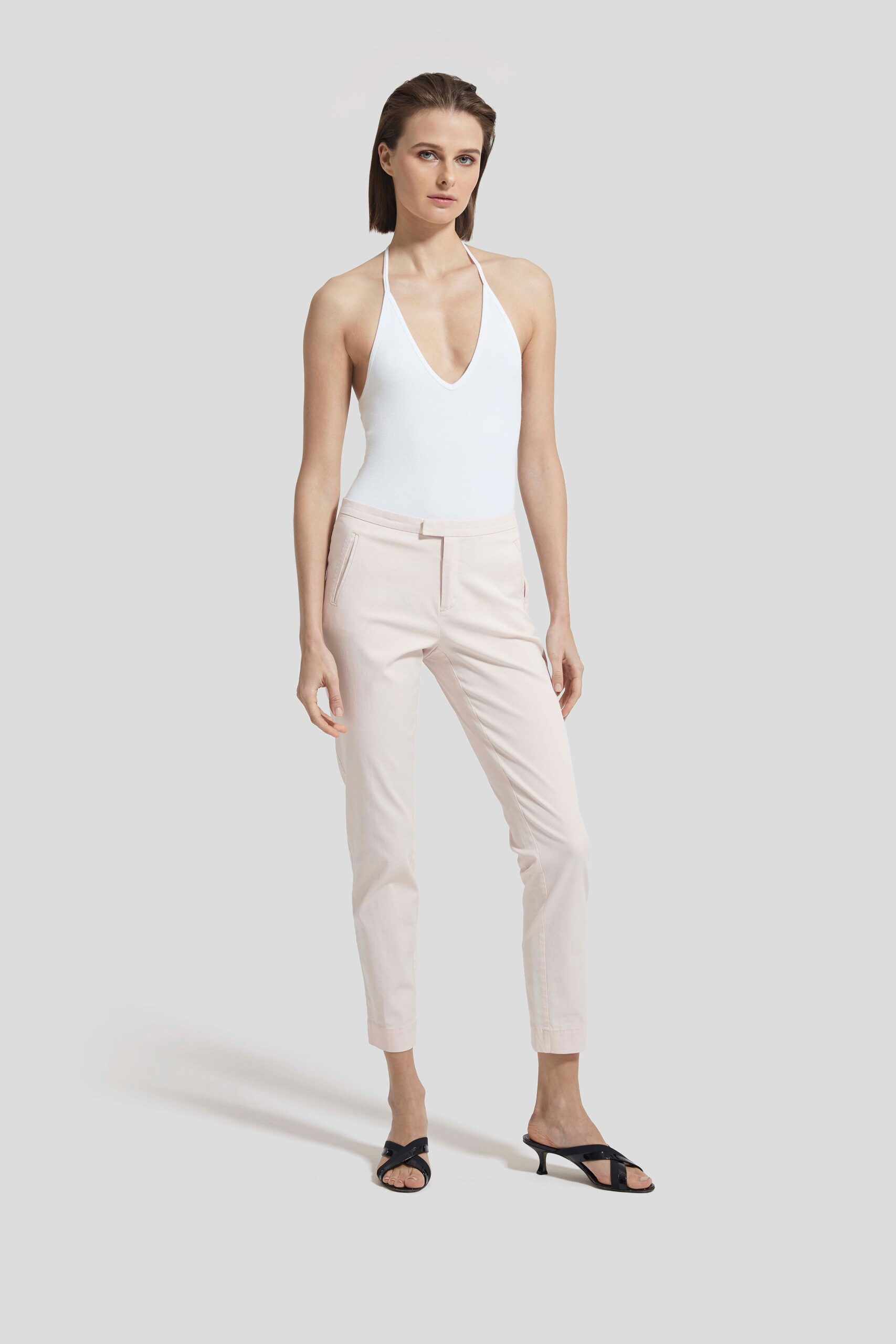 white bodysuit with pink tailored pants