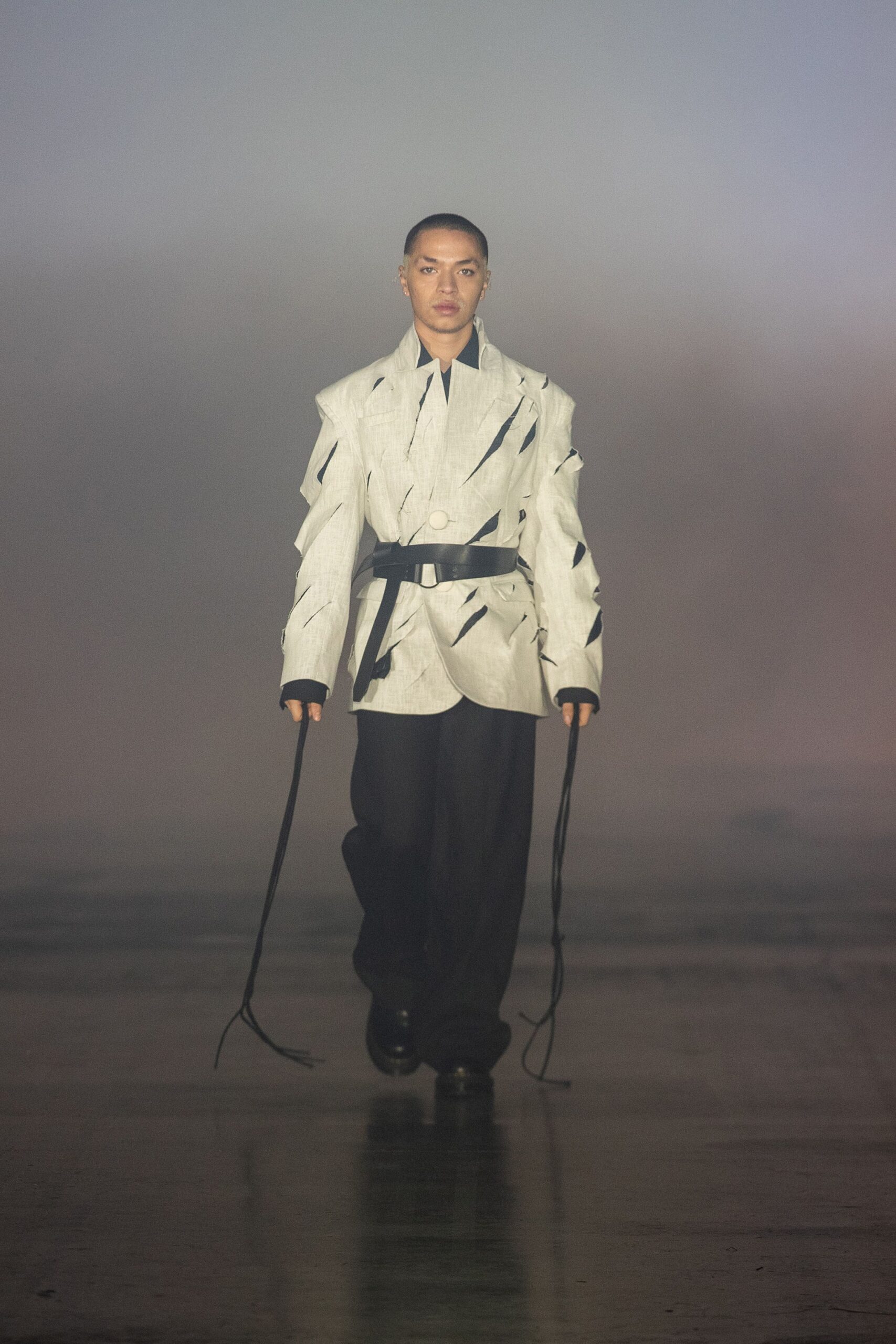 white fitted jacket and black relaxed pants