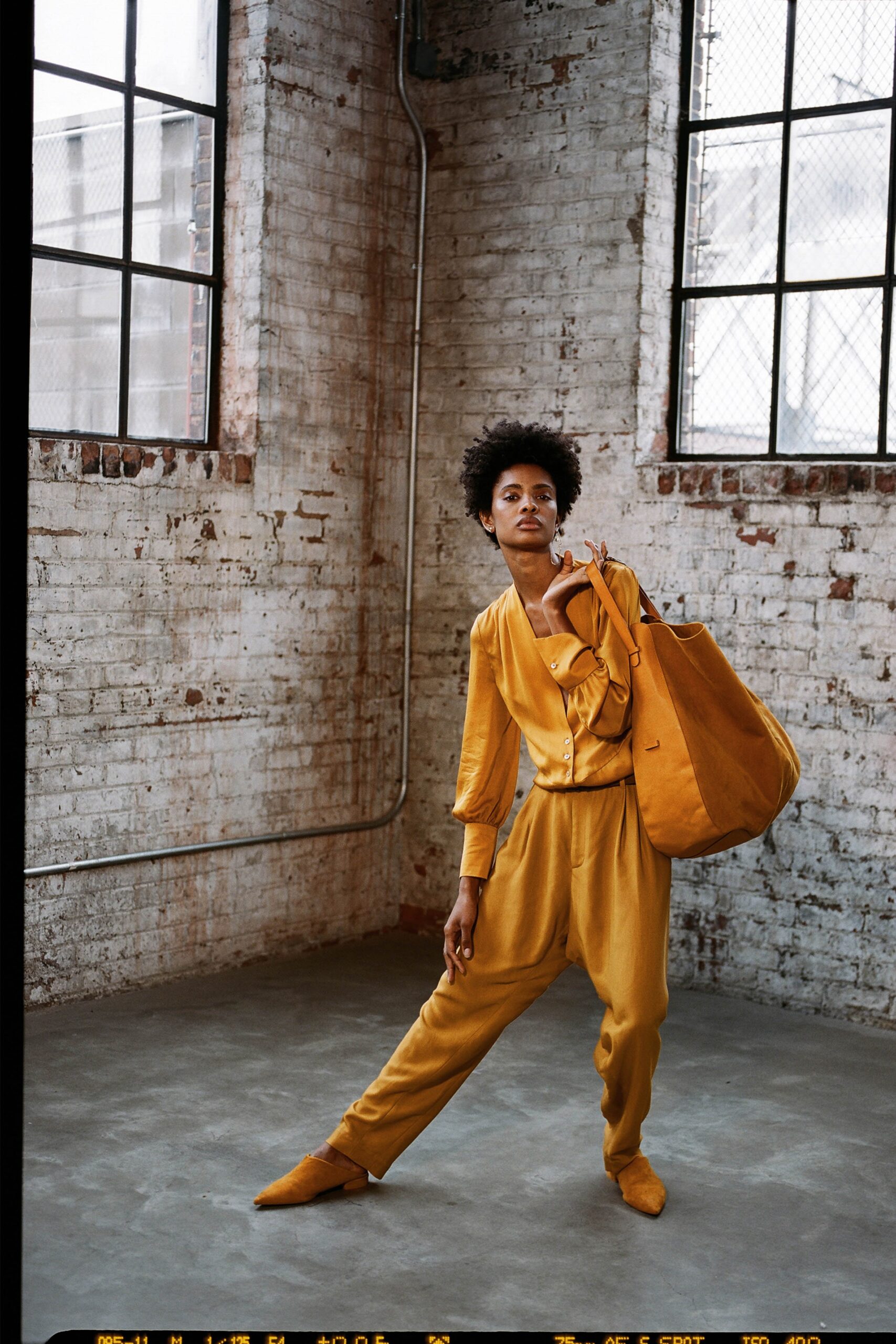 yellow fitted suit with bag