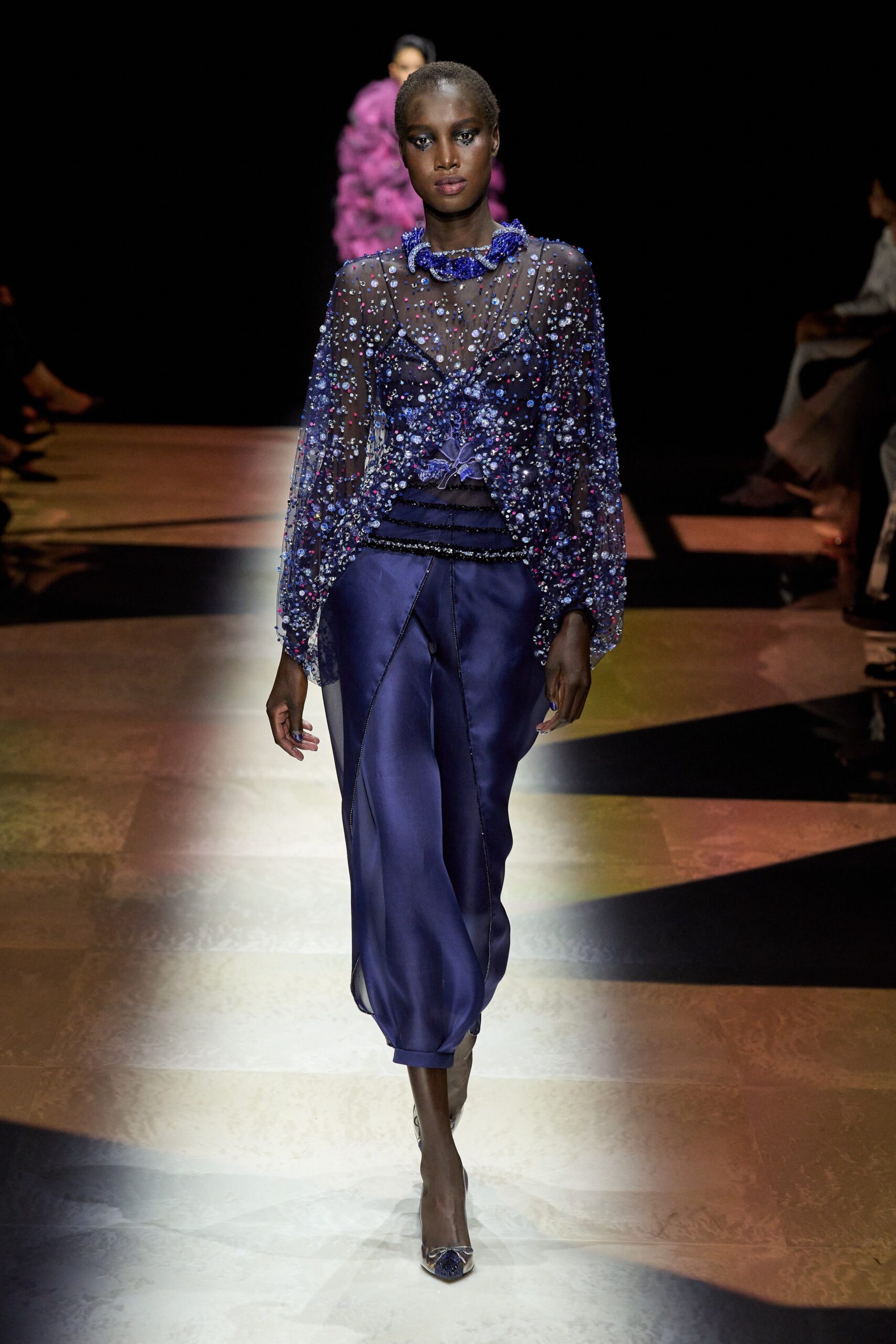 blue embellished sheer top with relaxed pants