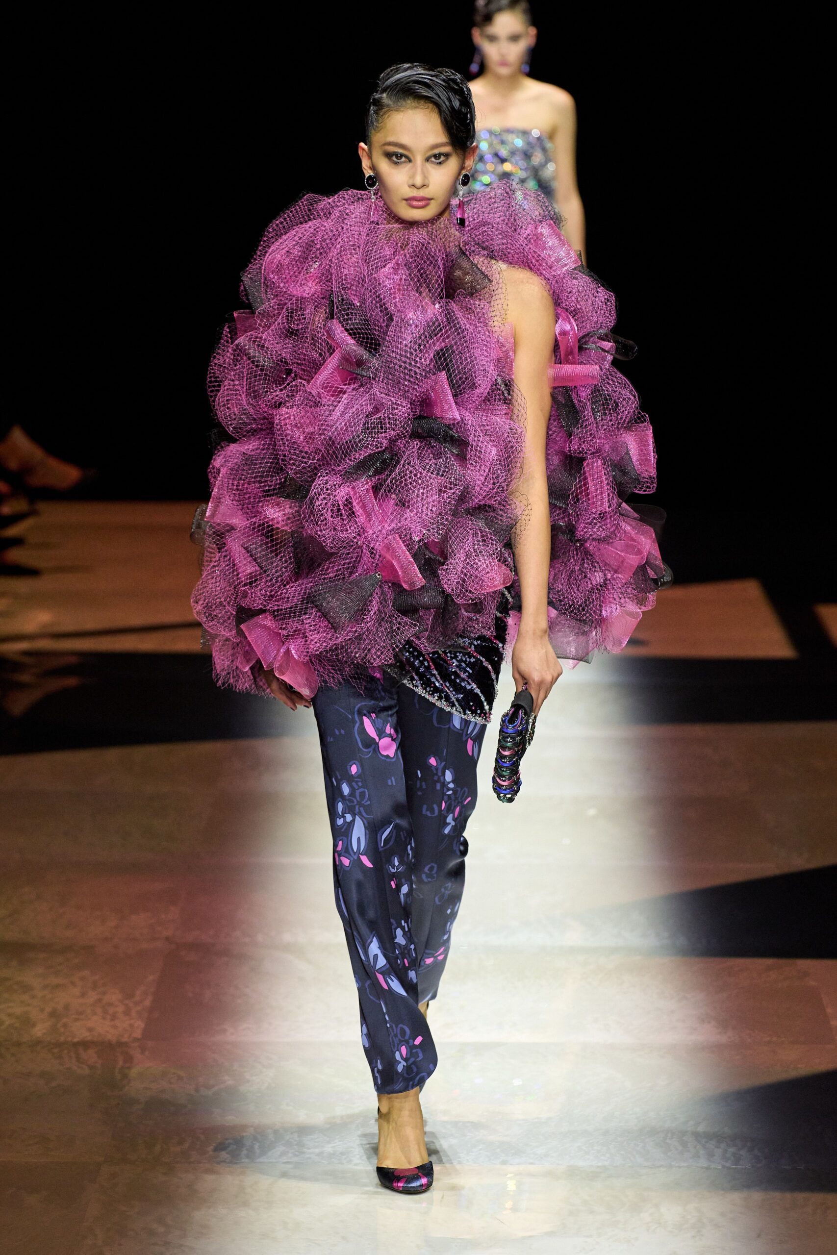 pink ruffled top with printed pants