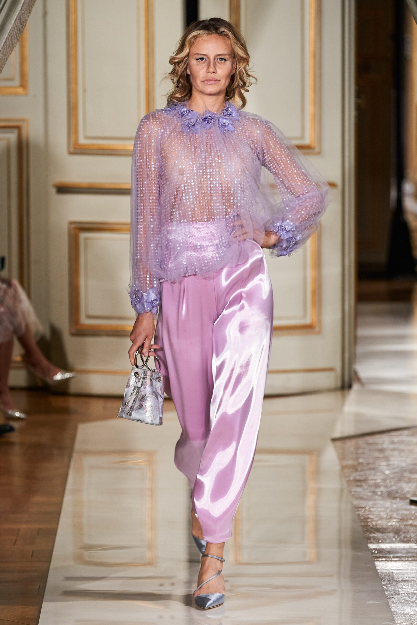 purple sheer blouse with pink pants