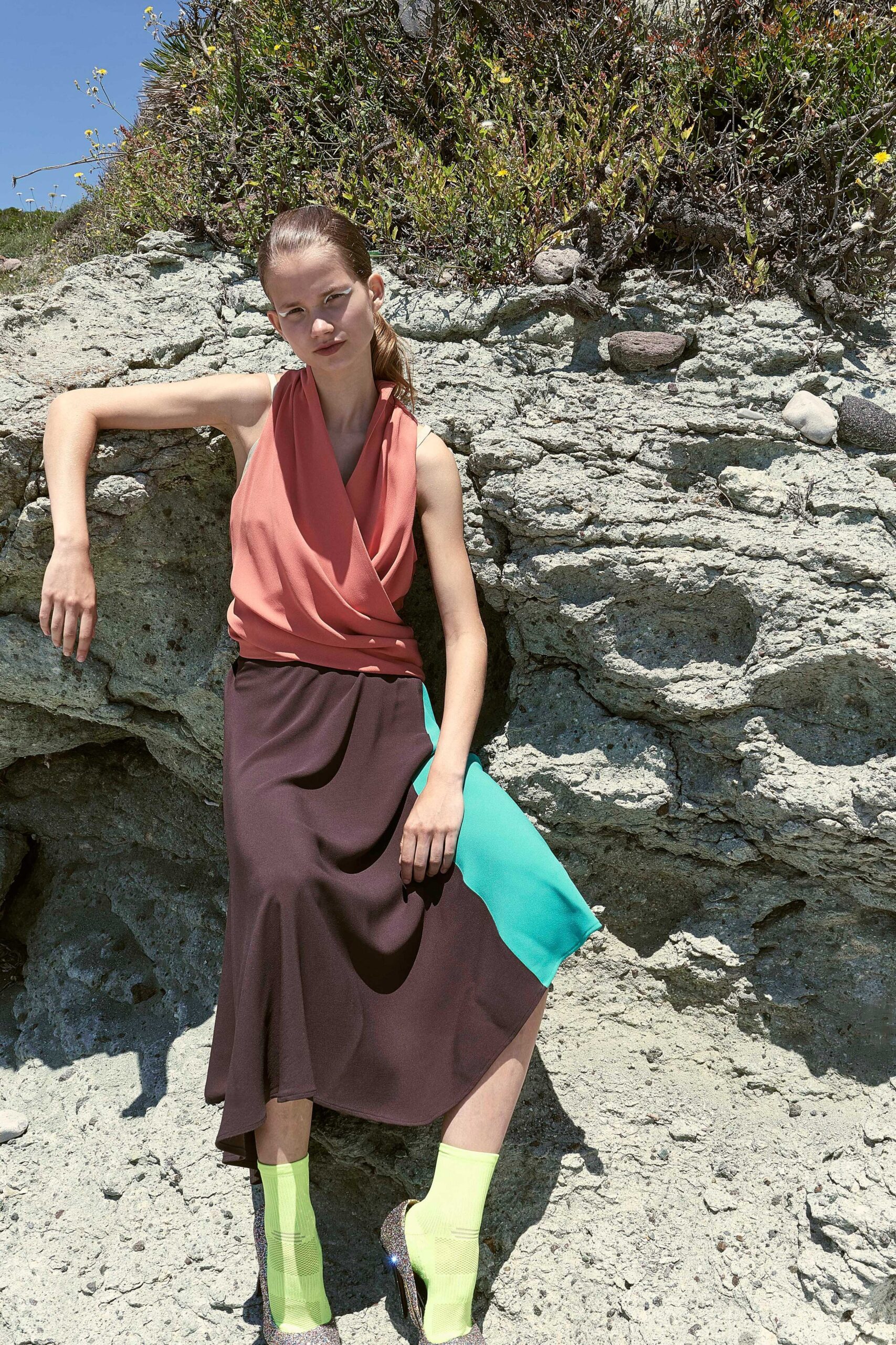 coral sleeveless top with asymmetric skirt