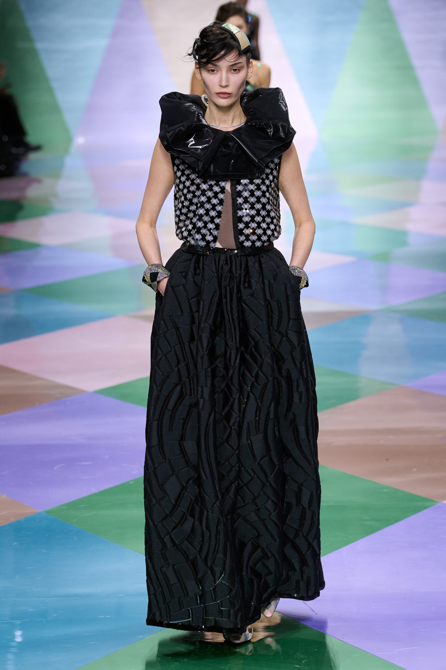 black and white ruffled top with pleated skirt
