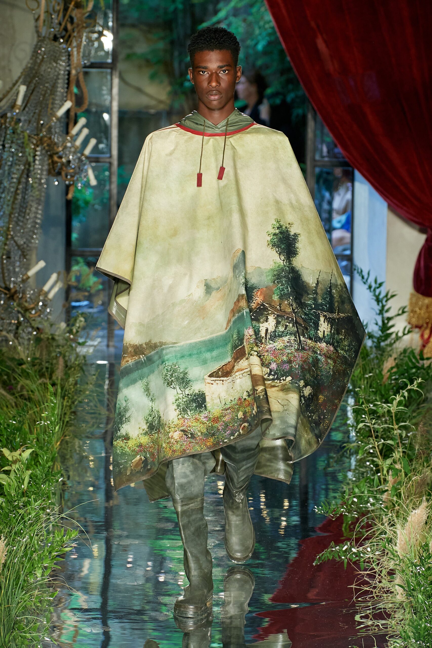 green printed poncho with gray boots