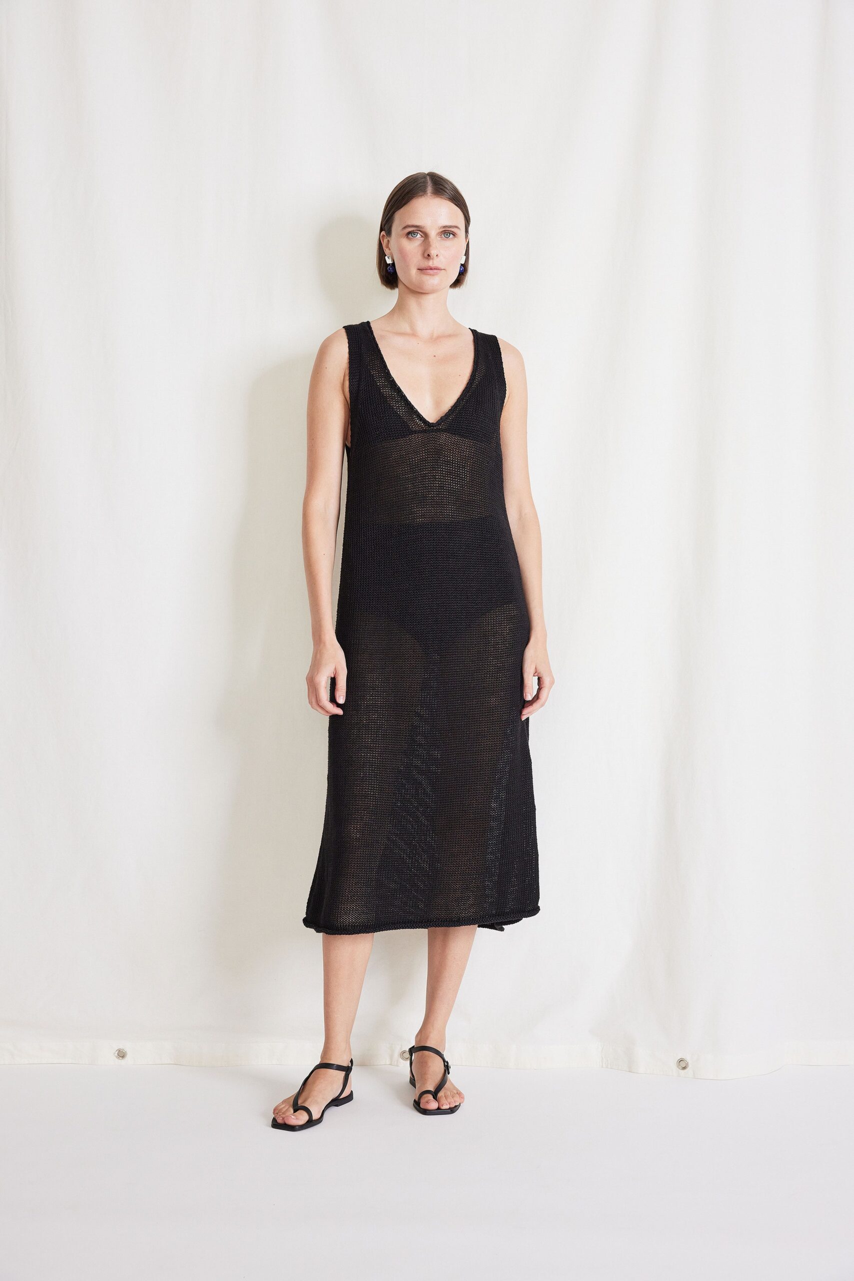 black fitted sleeveless dress