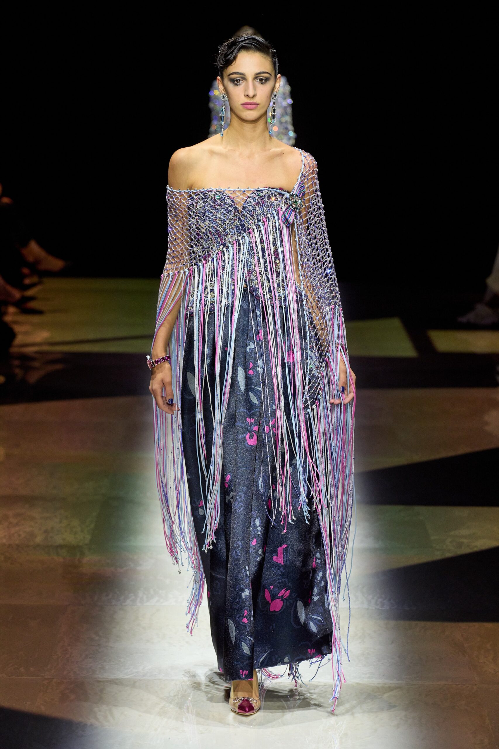 multi-colored fringed gown and cape