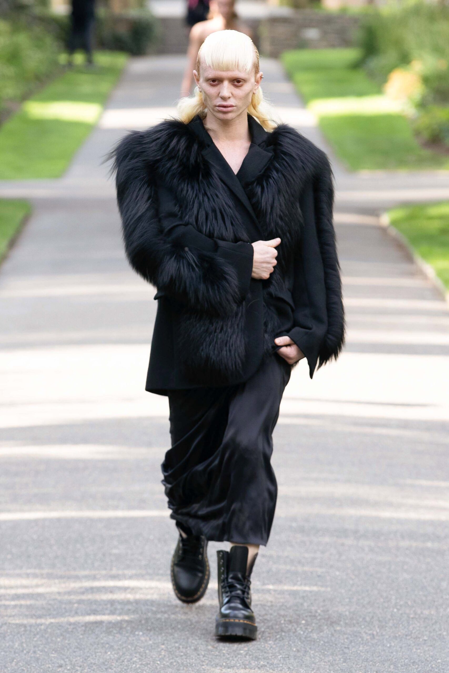 black fur coat and silk dress