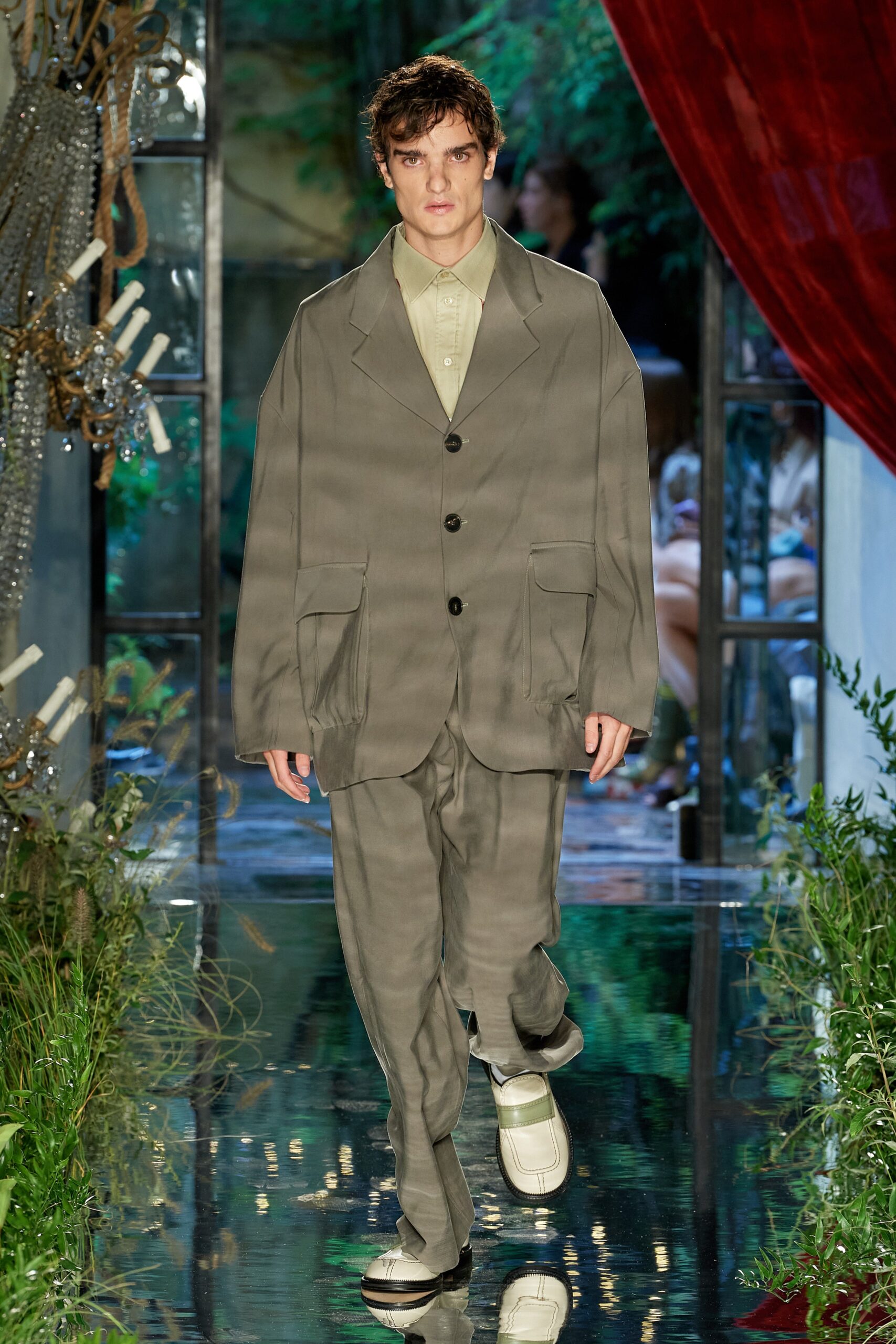 gray relaxed suit with white shoes