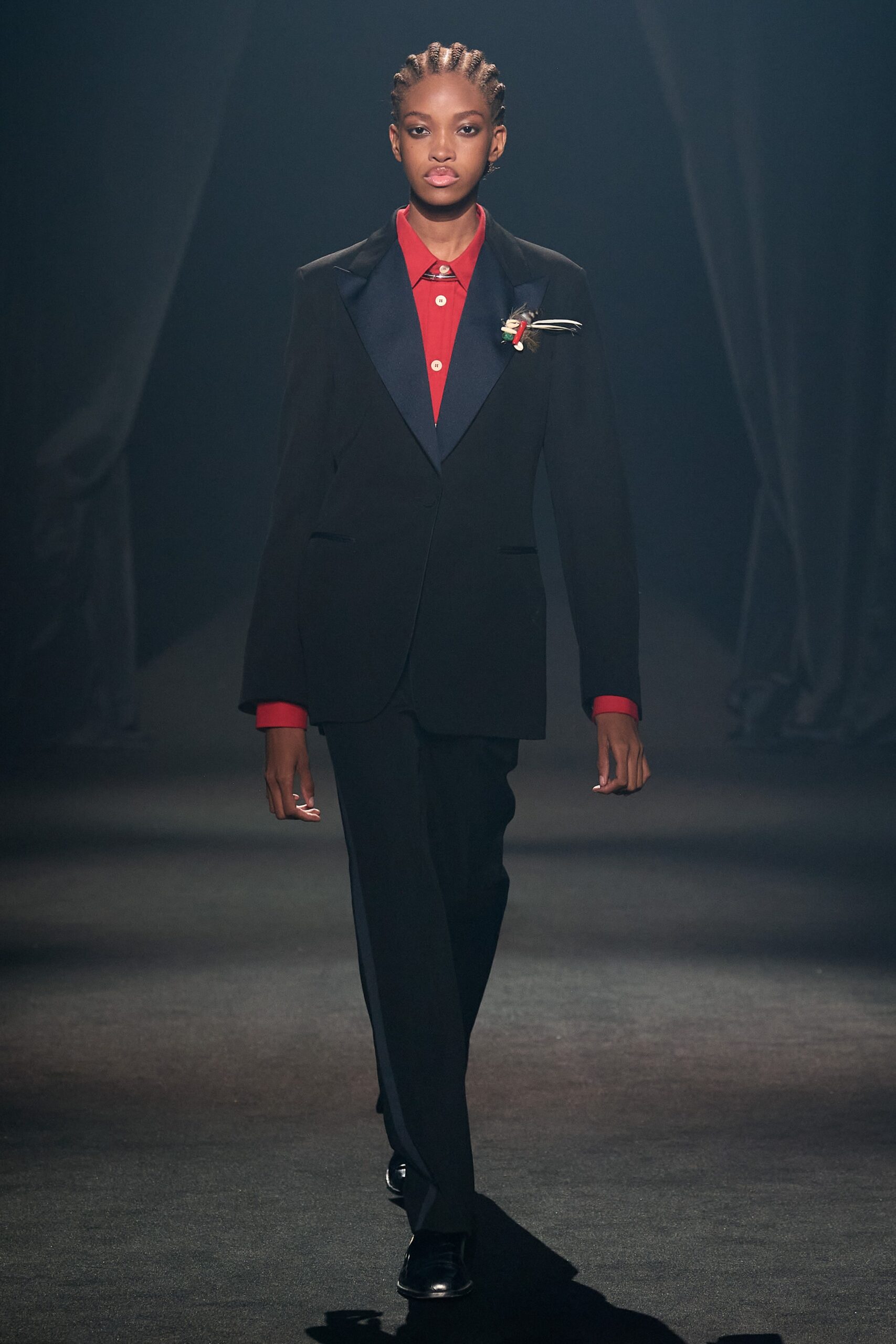 black tailored suit with red shirt