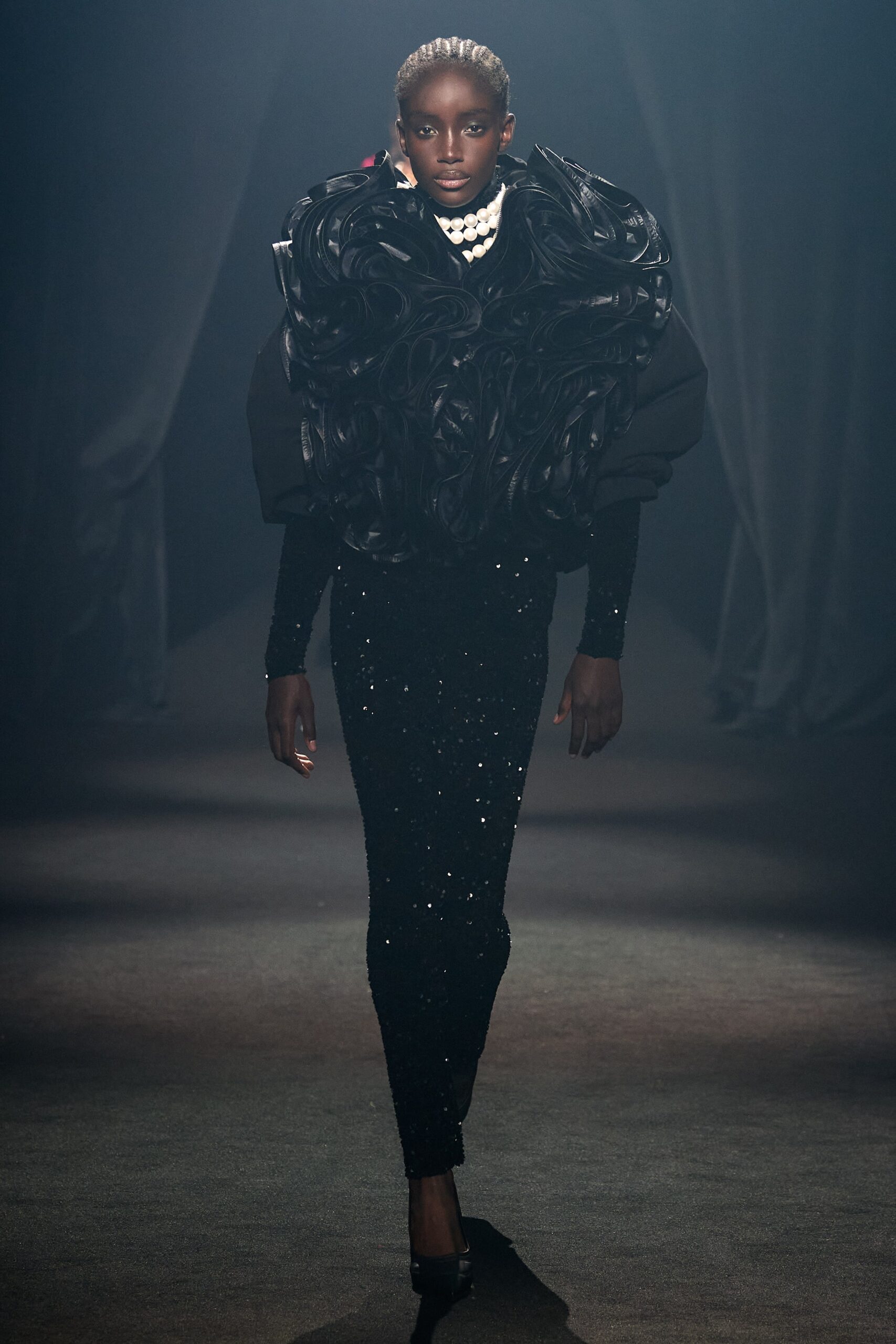 black sequin fitted dress with oversized cape