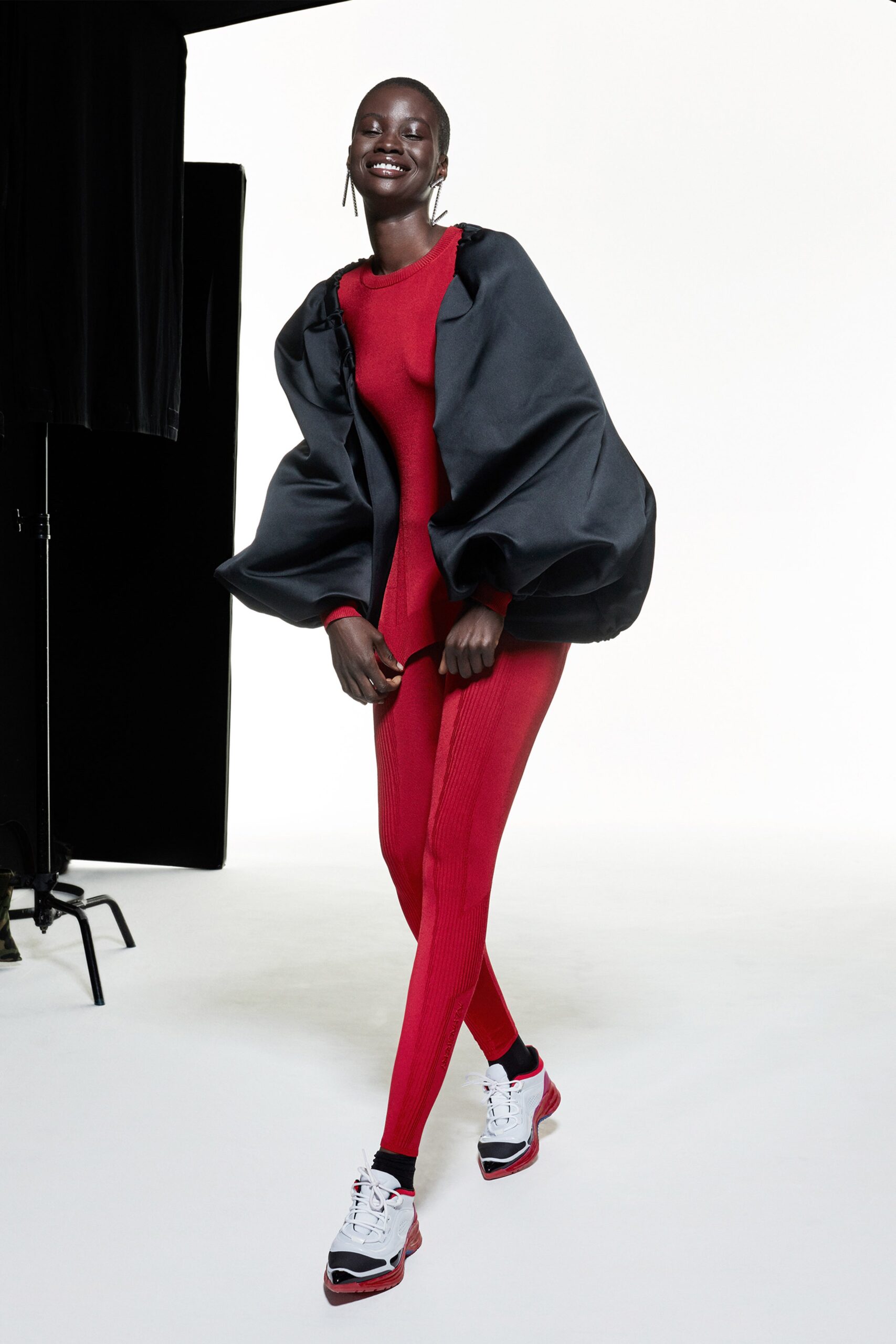 oversized black jacket with red bodysuit