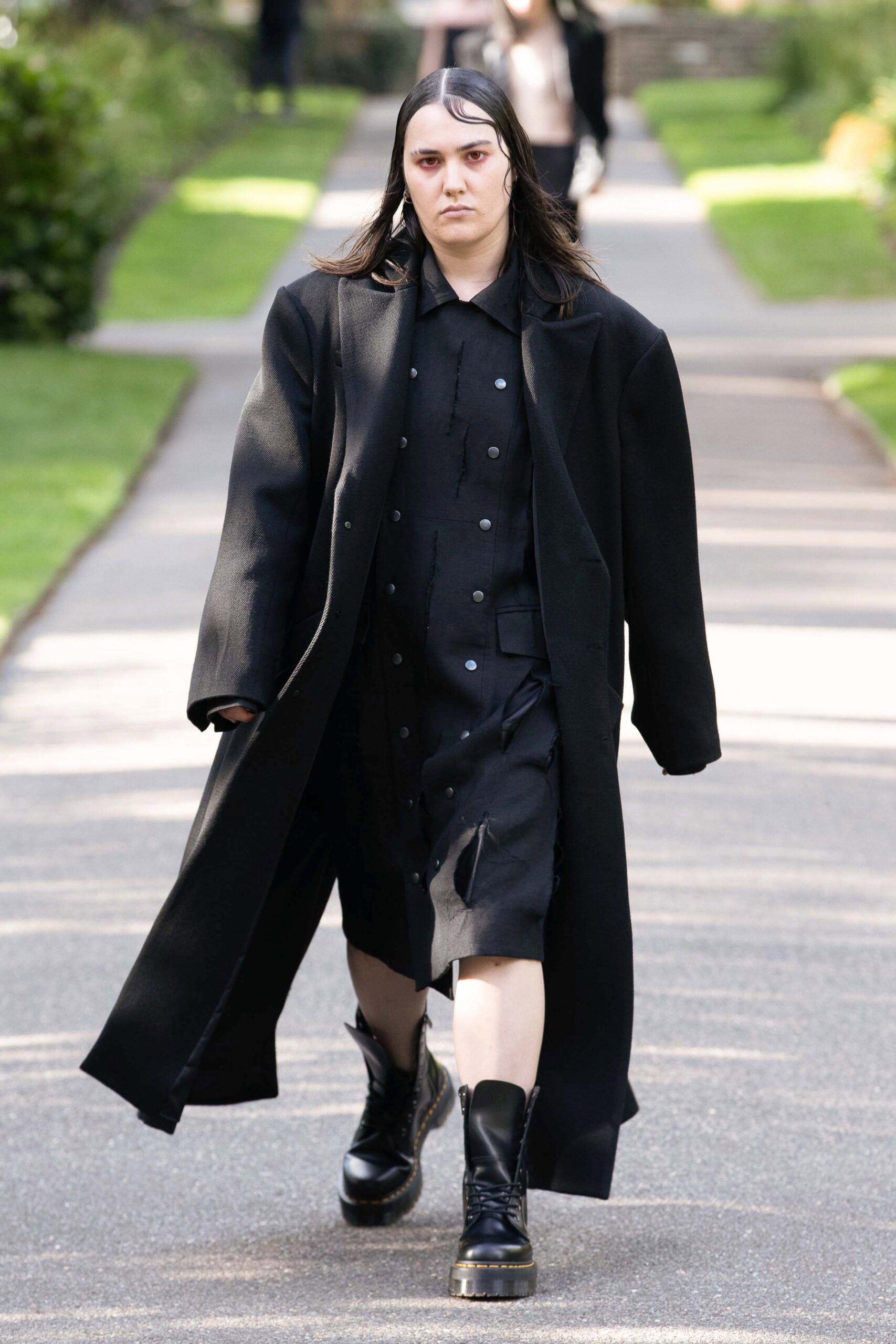 black oversized coat and fitted dress