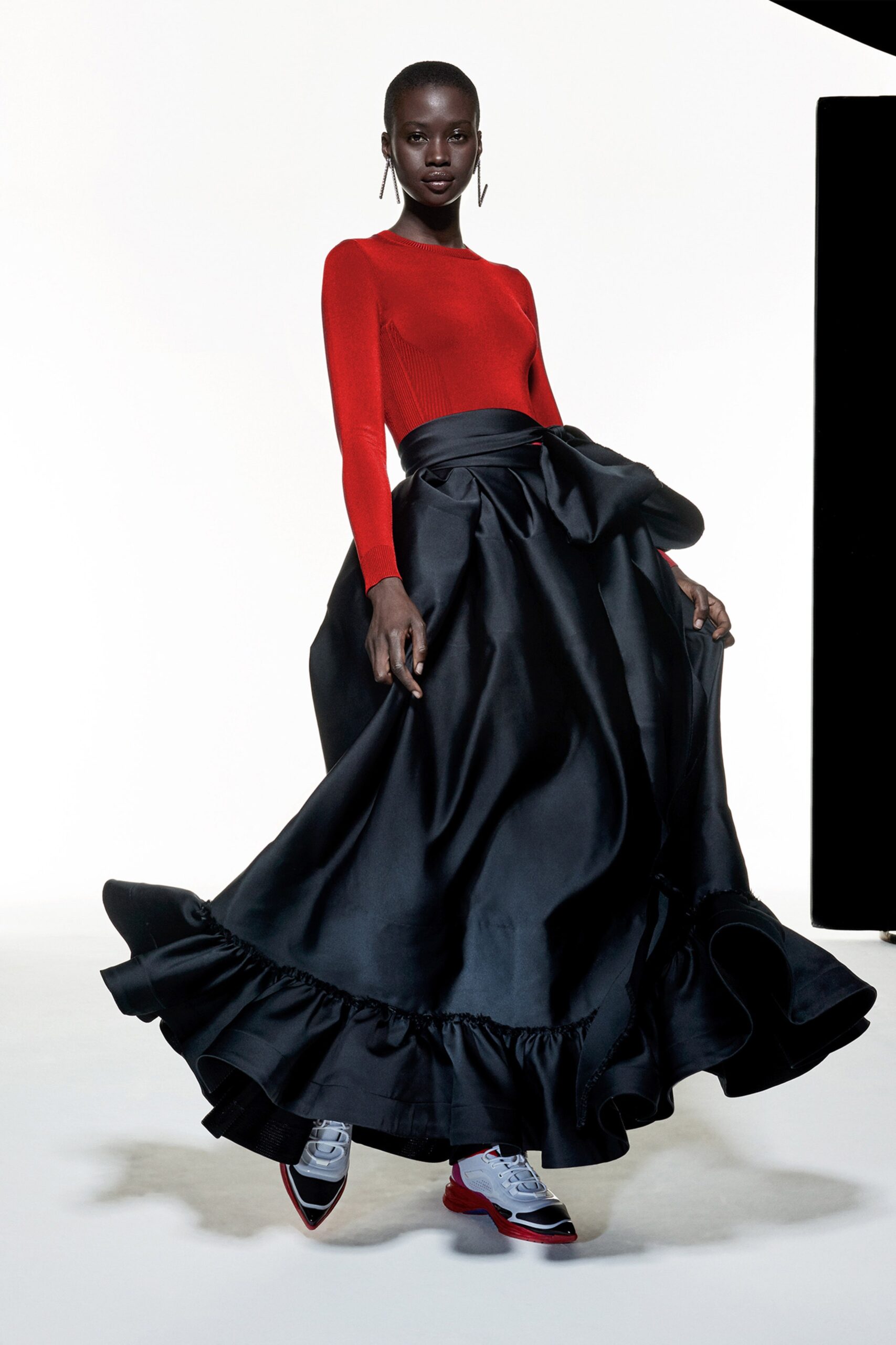 red fitted top black tiered skirt