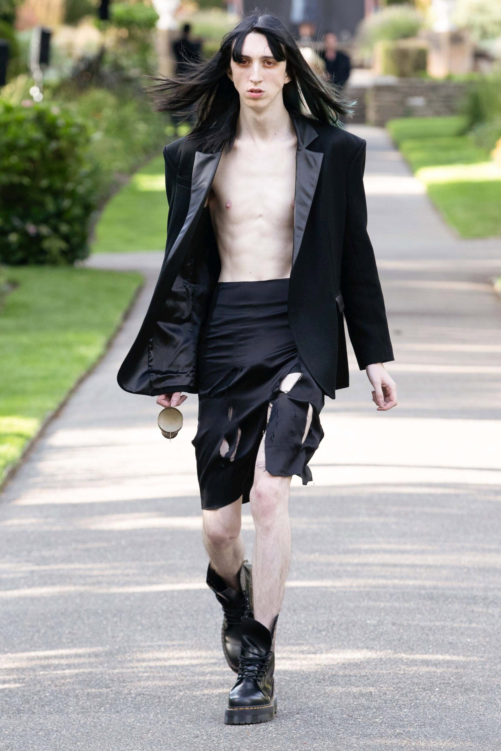 black tailored blazer and distressed skirt