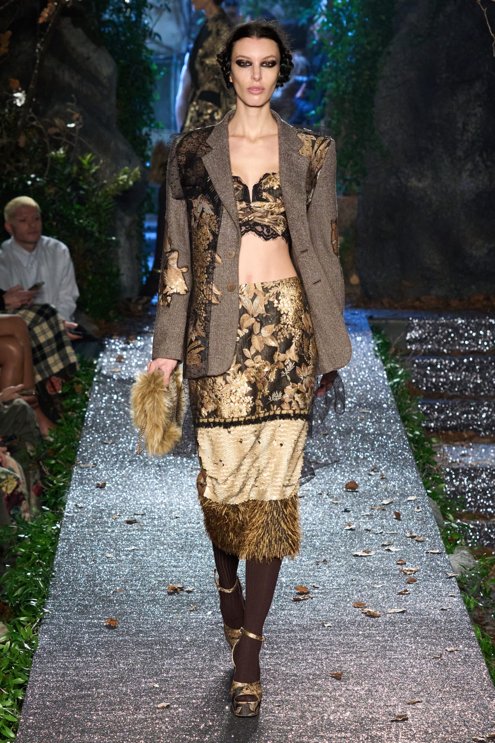 brown tweed blazer with gold bustier and skirt