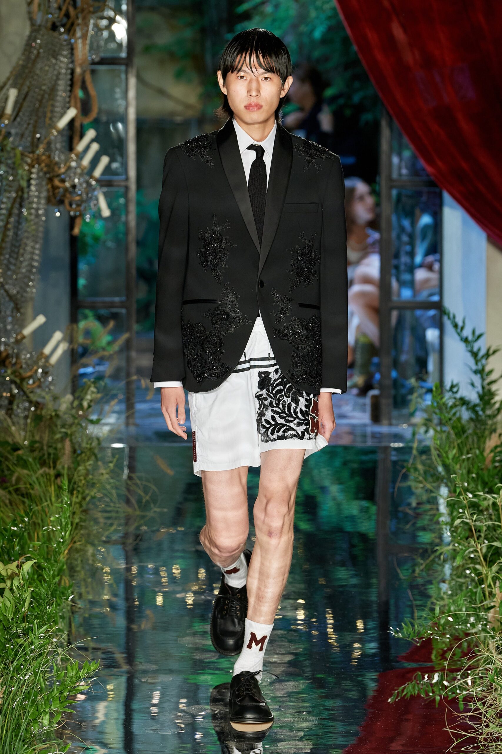 black embroidered blazer with white shorts