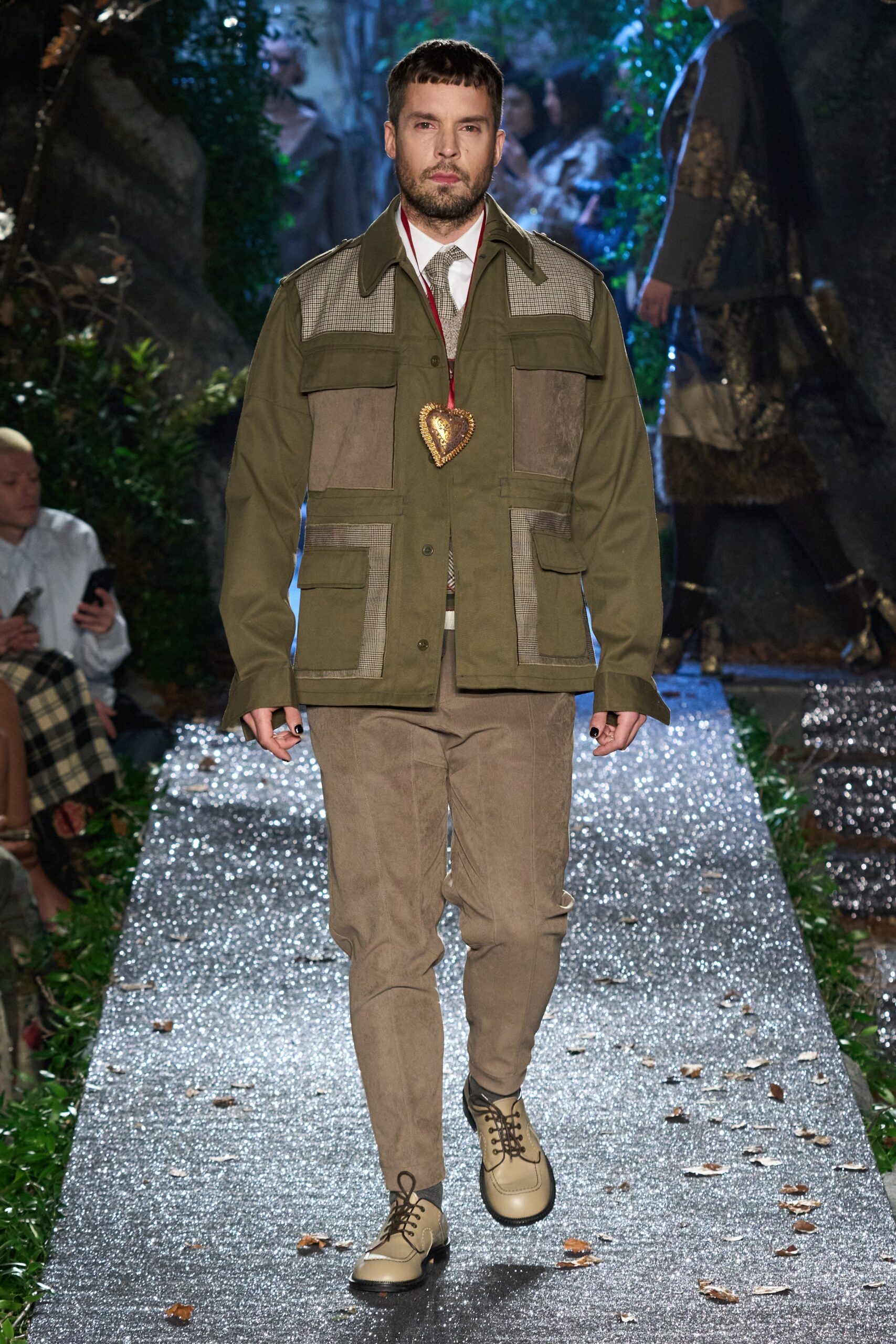 green relaxed jacket with beige pants