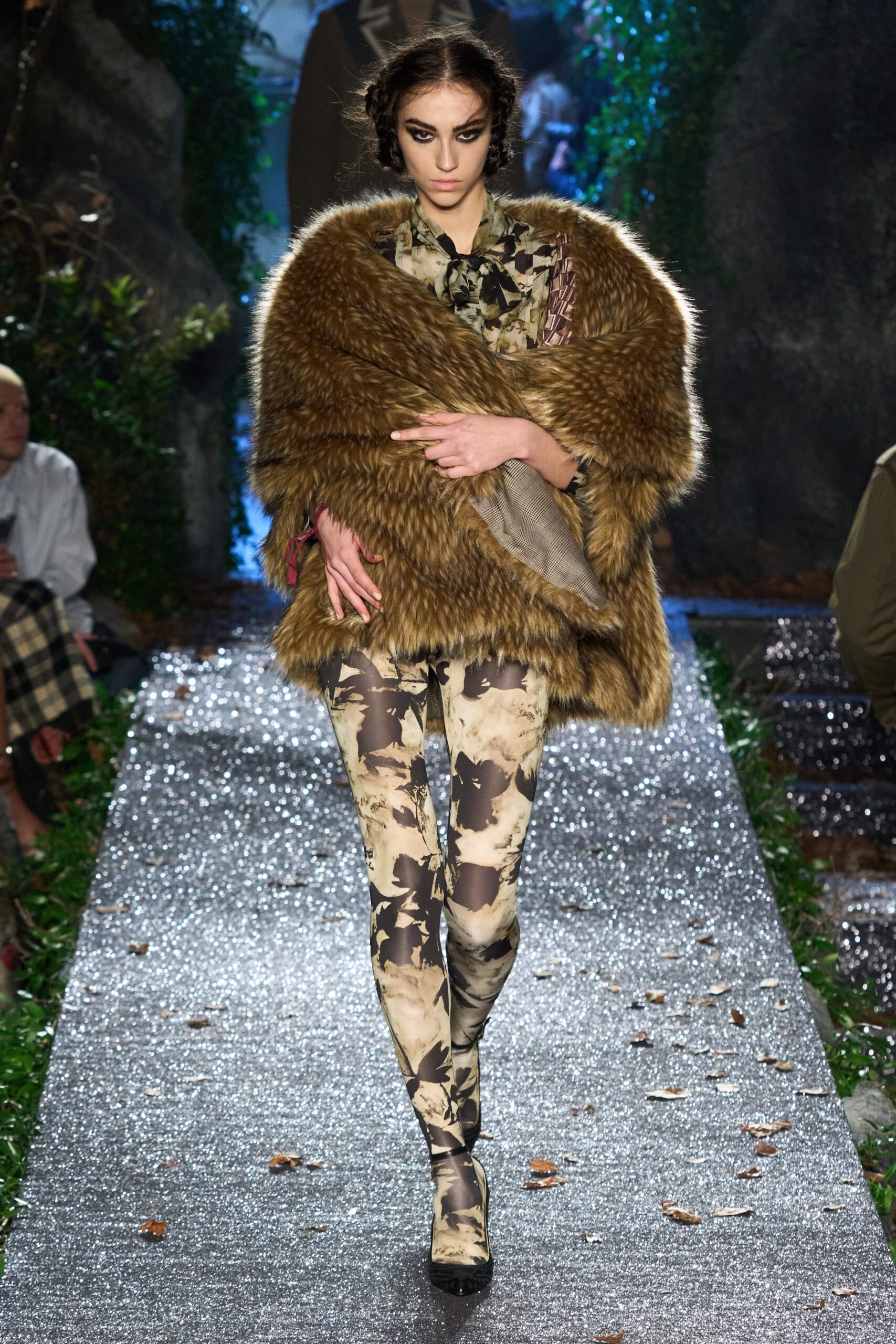brown faux-fur cape with camouflage pants