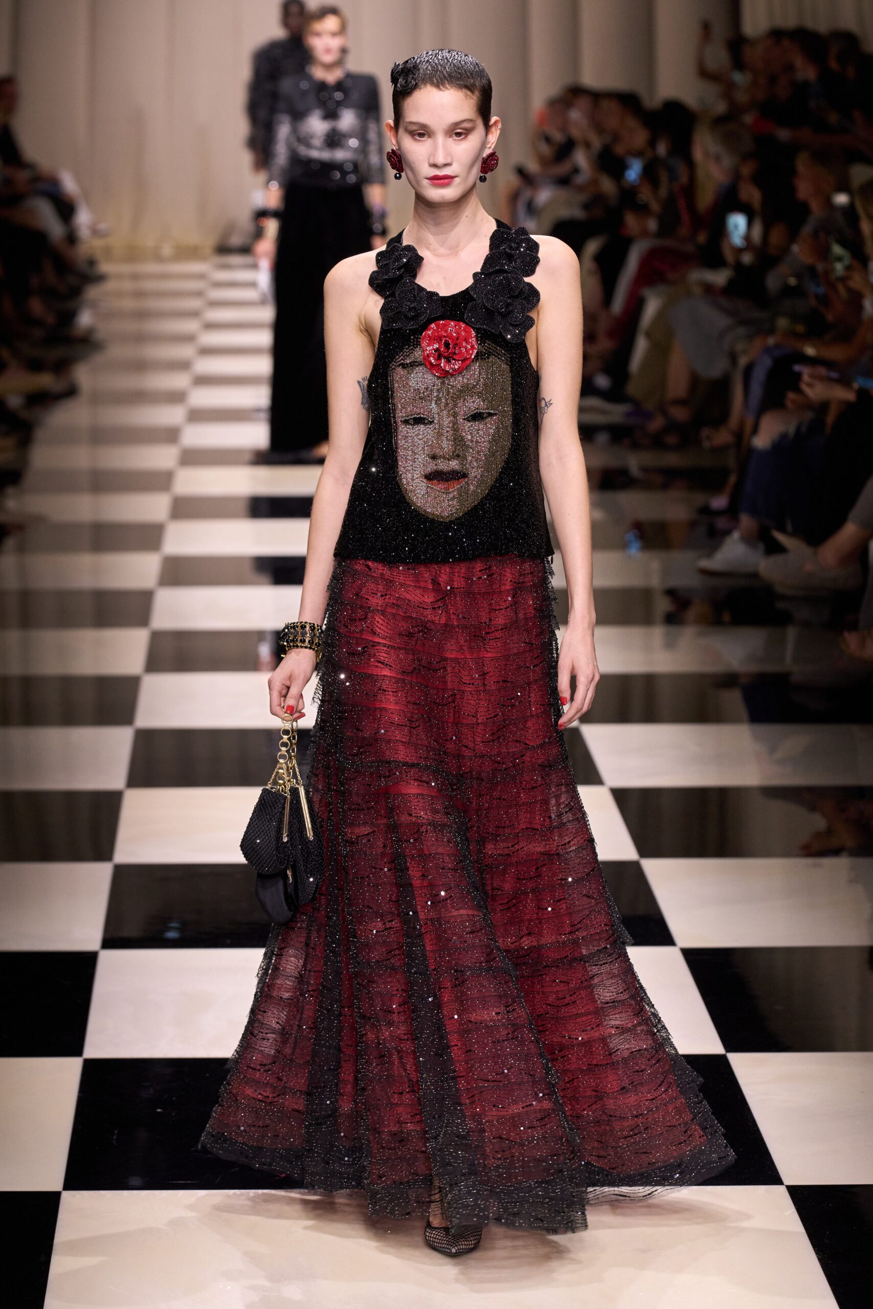 black silk sleeveless top and red tulle skirt