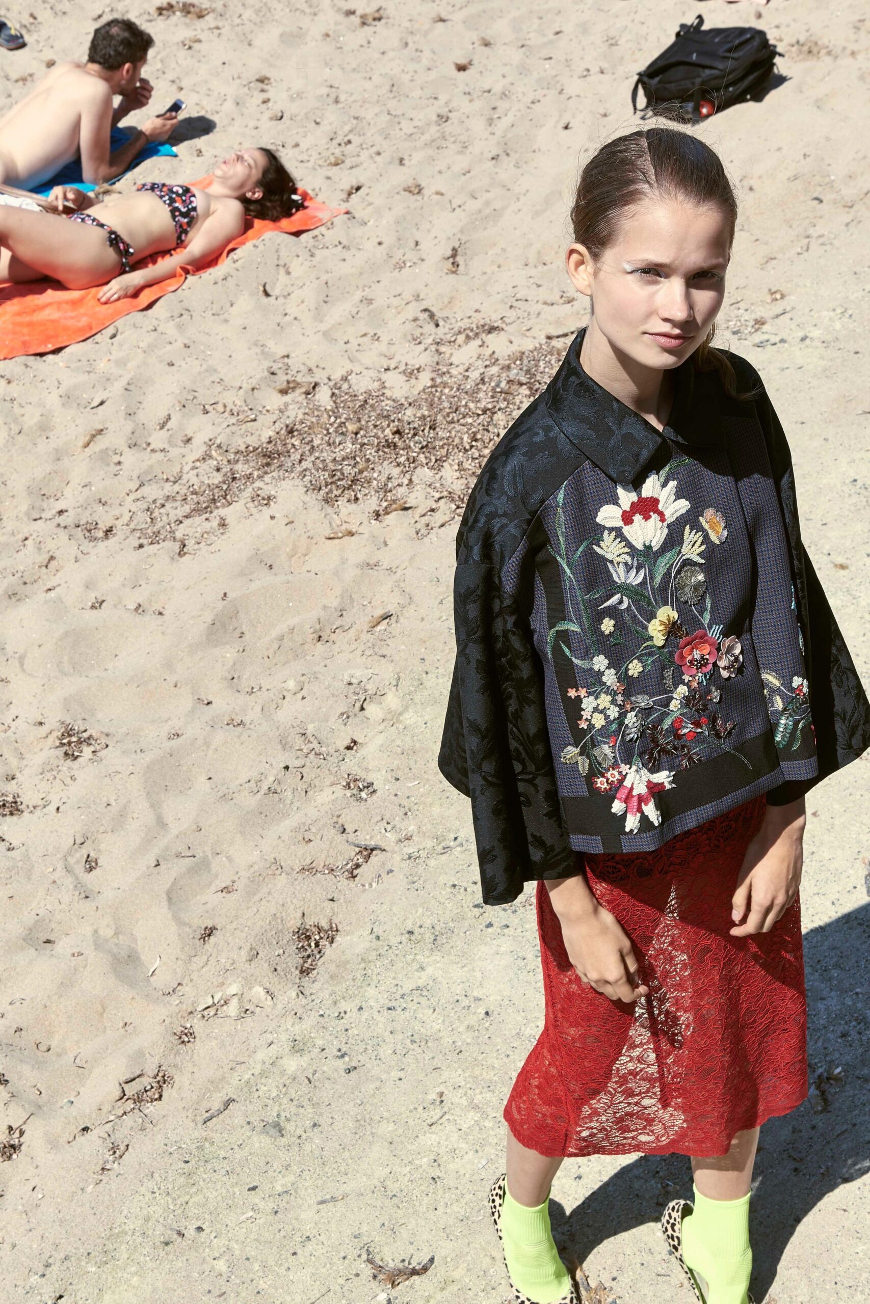 black embroidered cape red lace skirt