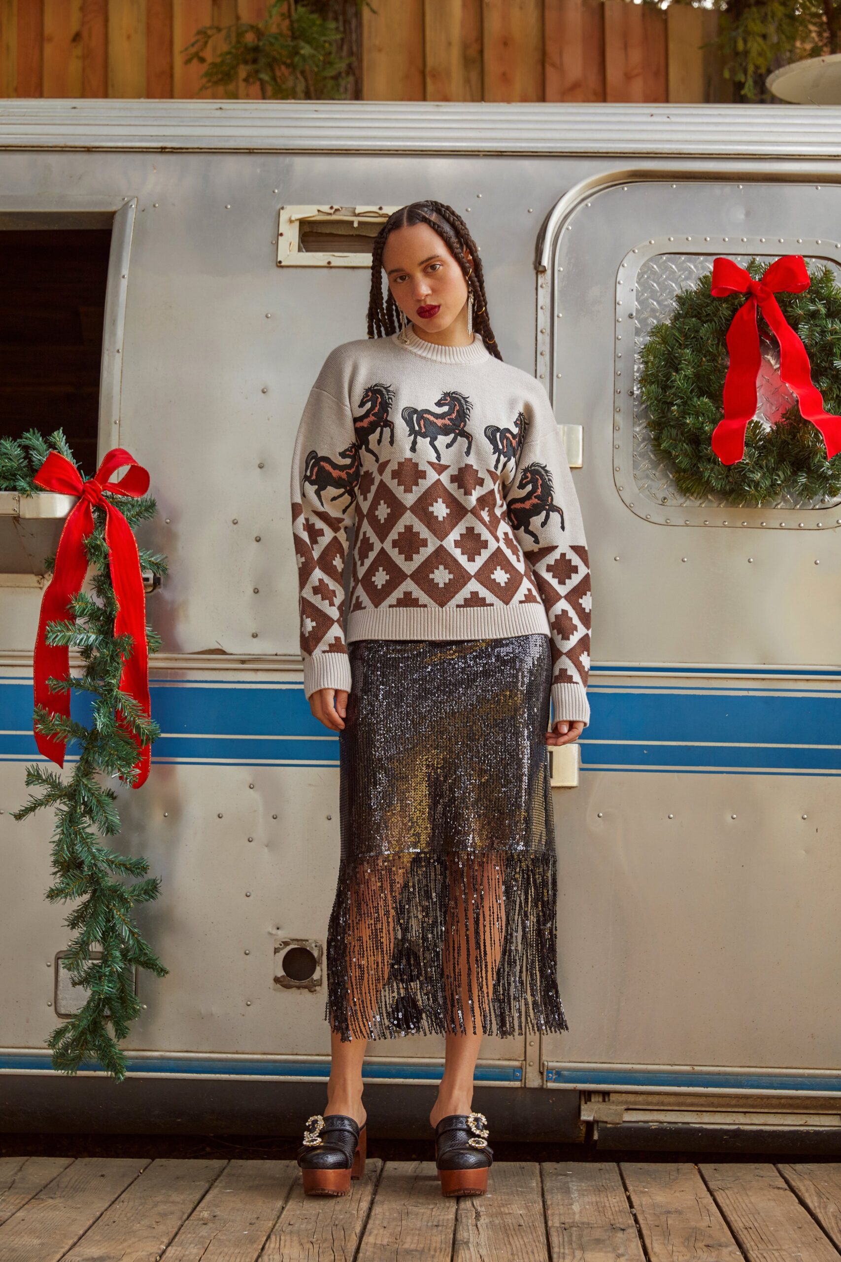 gray printed sweater and black fringed skirt