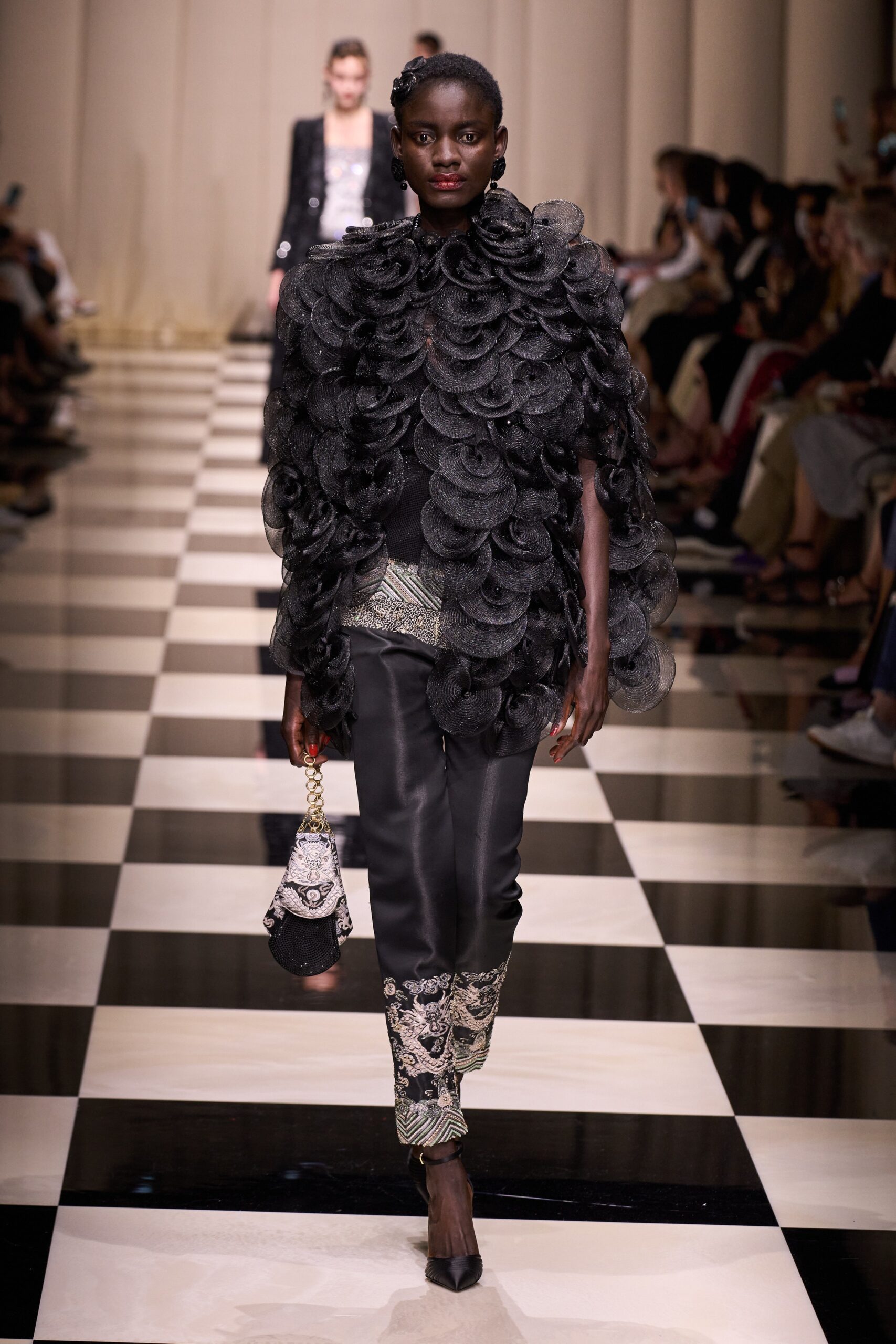 black layered top with fitted pants