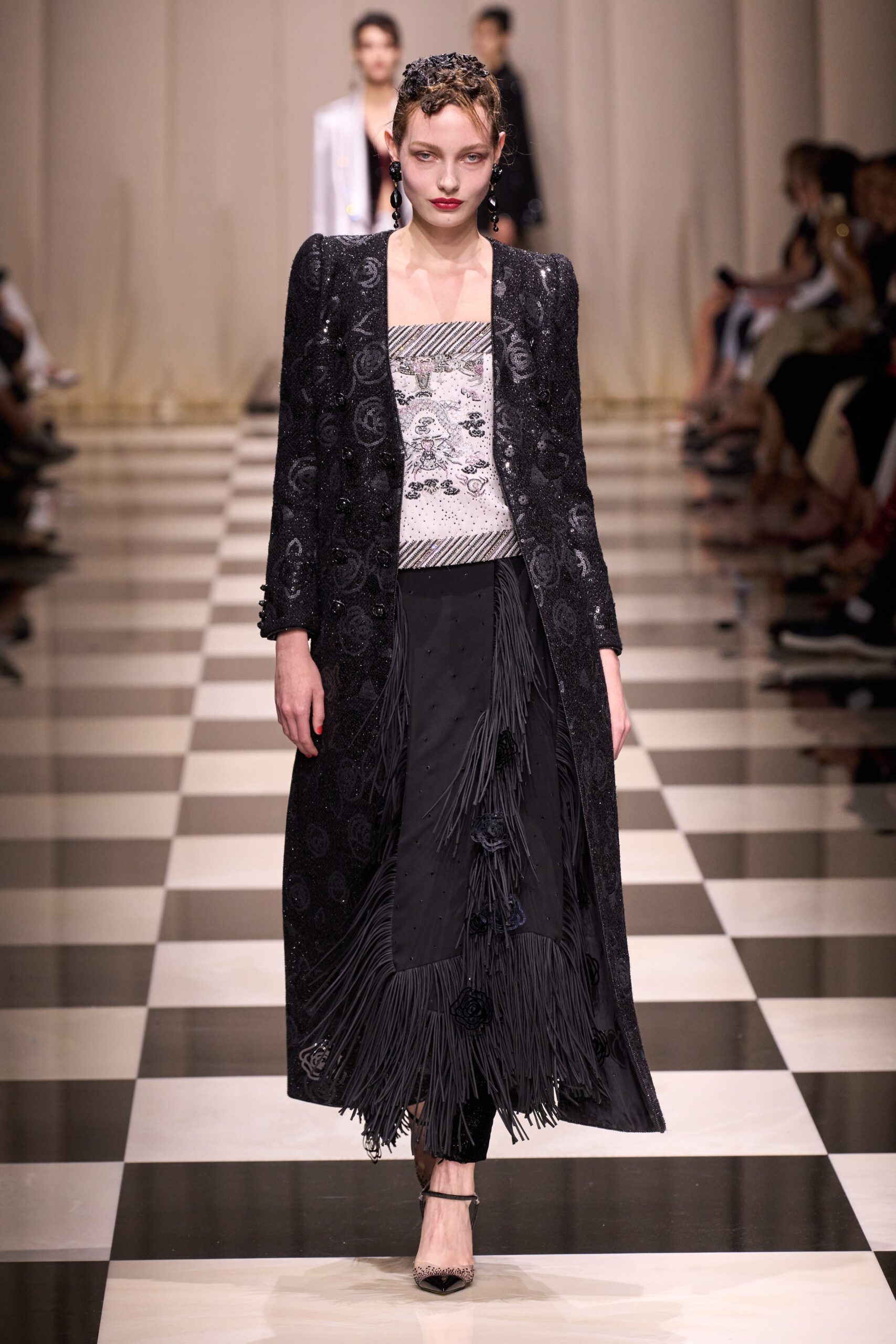 black embroidered coat with fringed skirt