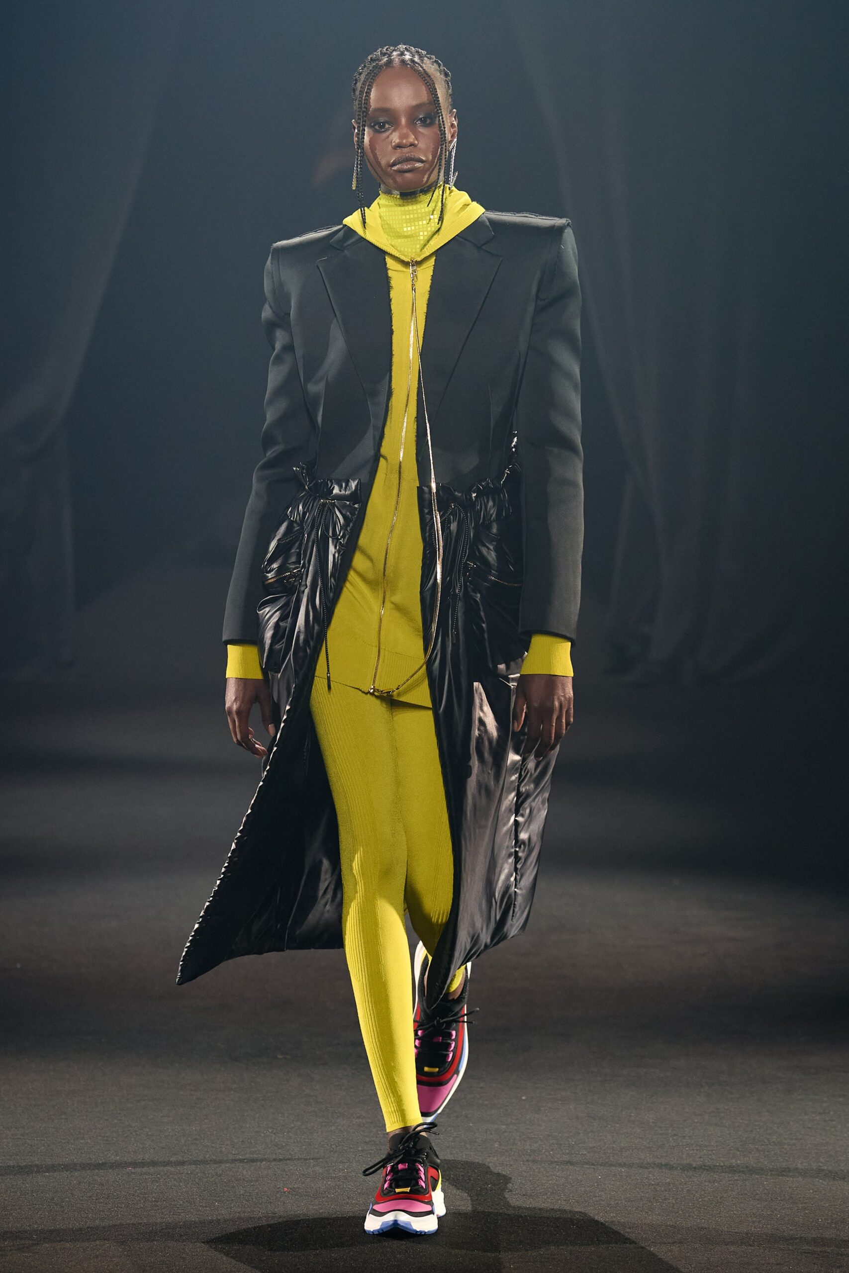 black leather coat with yellow jumpsuit