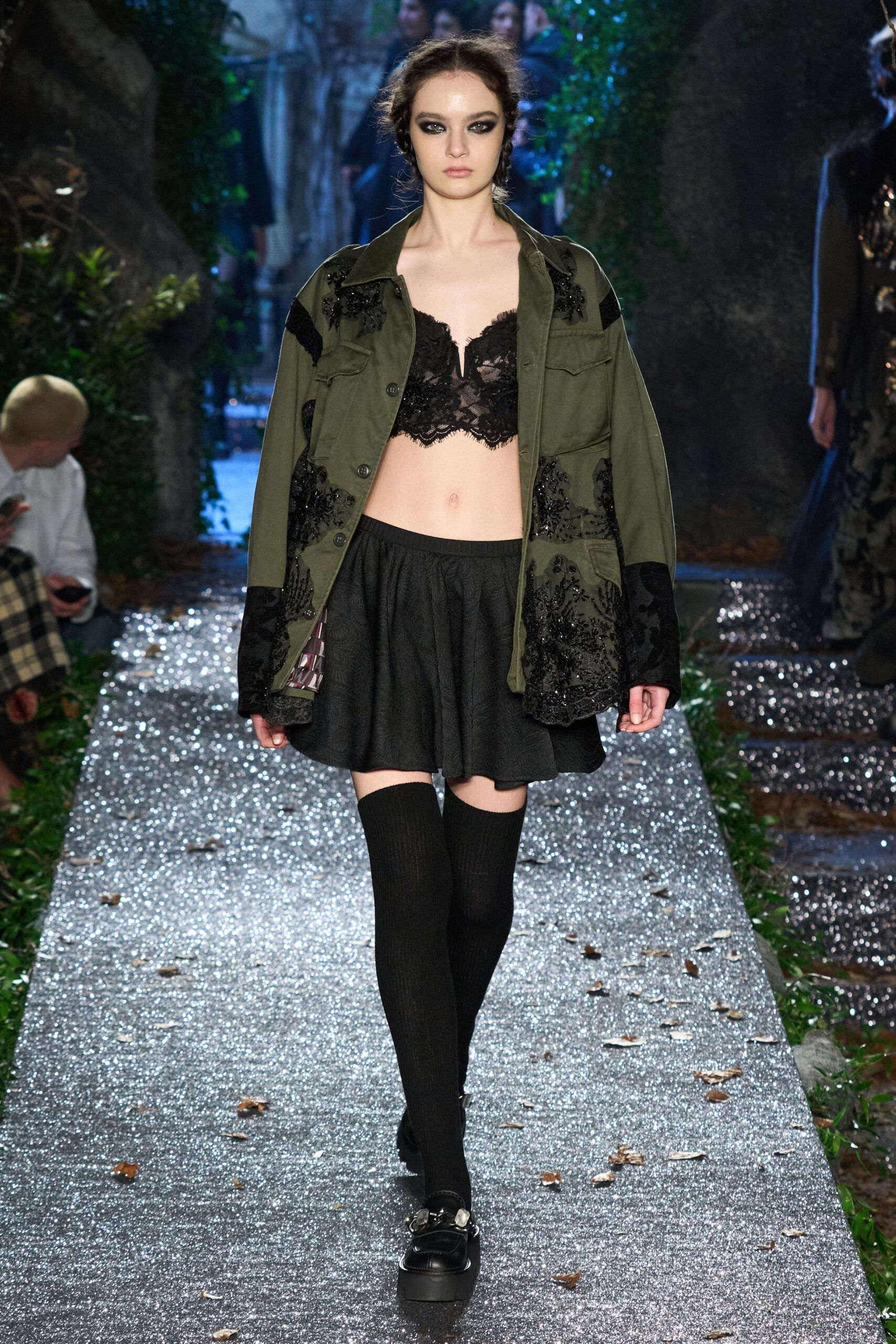 green embroidered jacket with black lace bra