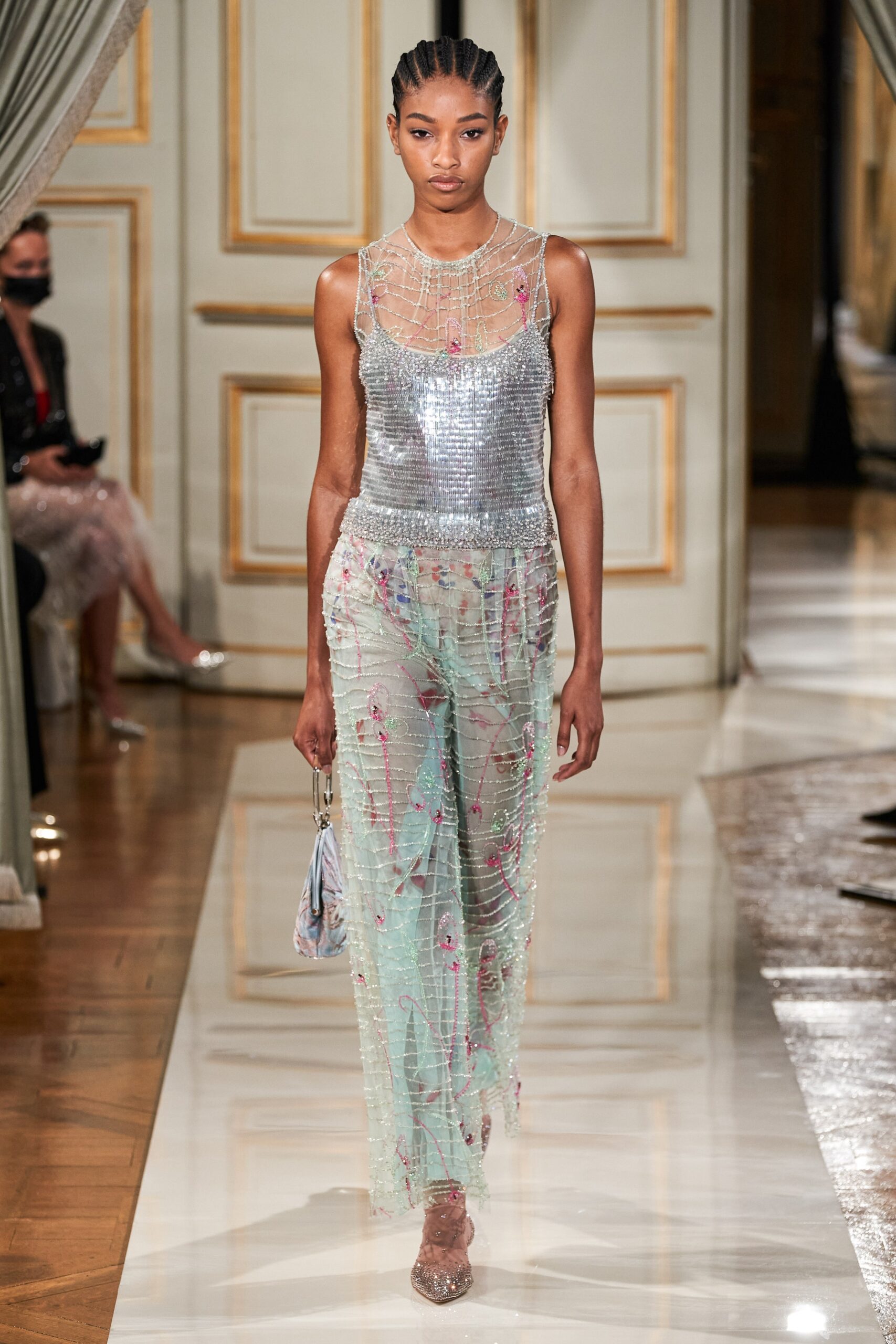 silver sequin sleeveless top and sheer pants